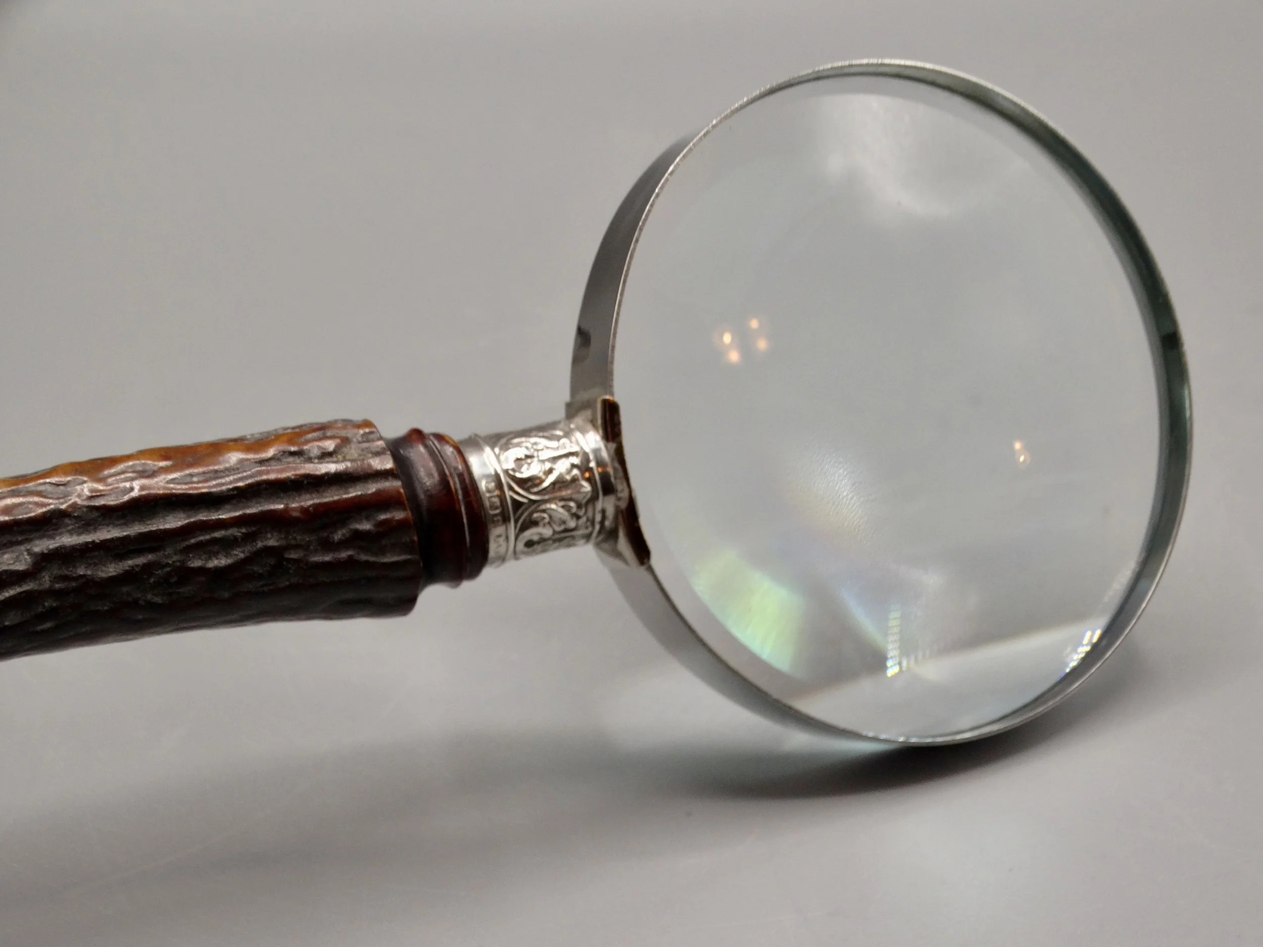 Clear Hilkinson glass lens on antique sterling and stag magnifying glass, perfect for reading fine print