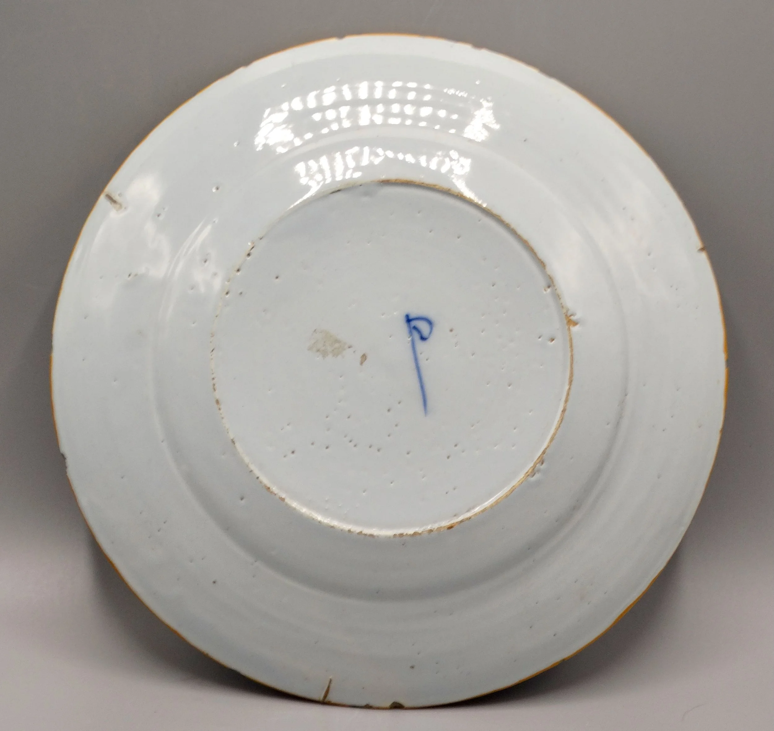 Porceleyne Bijl hatchet mark on reverse of second 18th-century Dutch Delft plate.