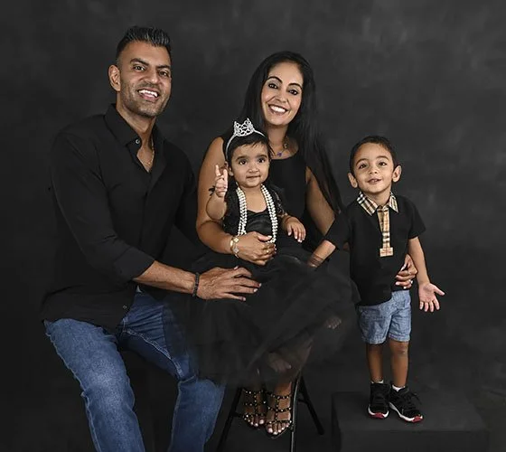 first birthday family photoshoot all wearing black outfits