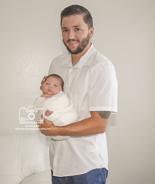 Miami-In-Home-Newborn-photographer dad holding newborn son