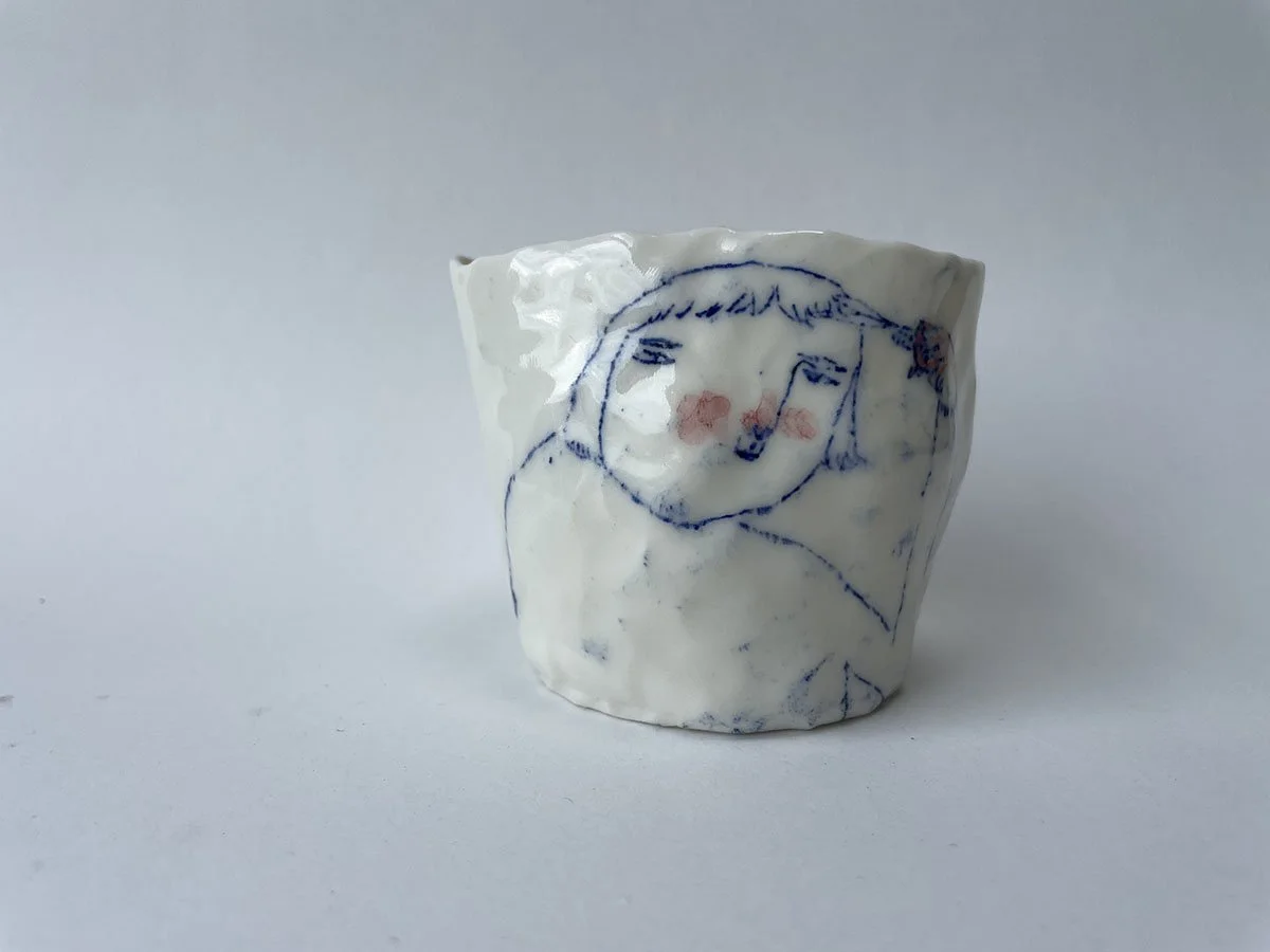 Illustrated ceramic cup