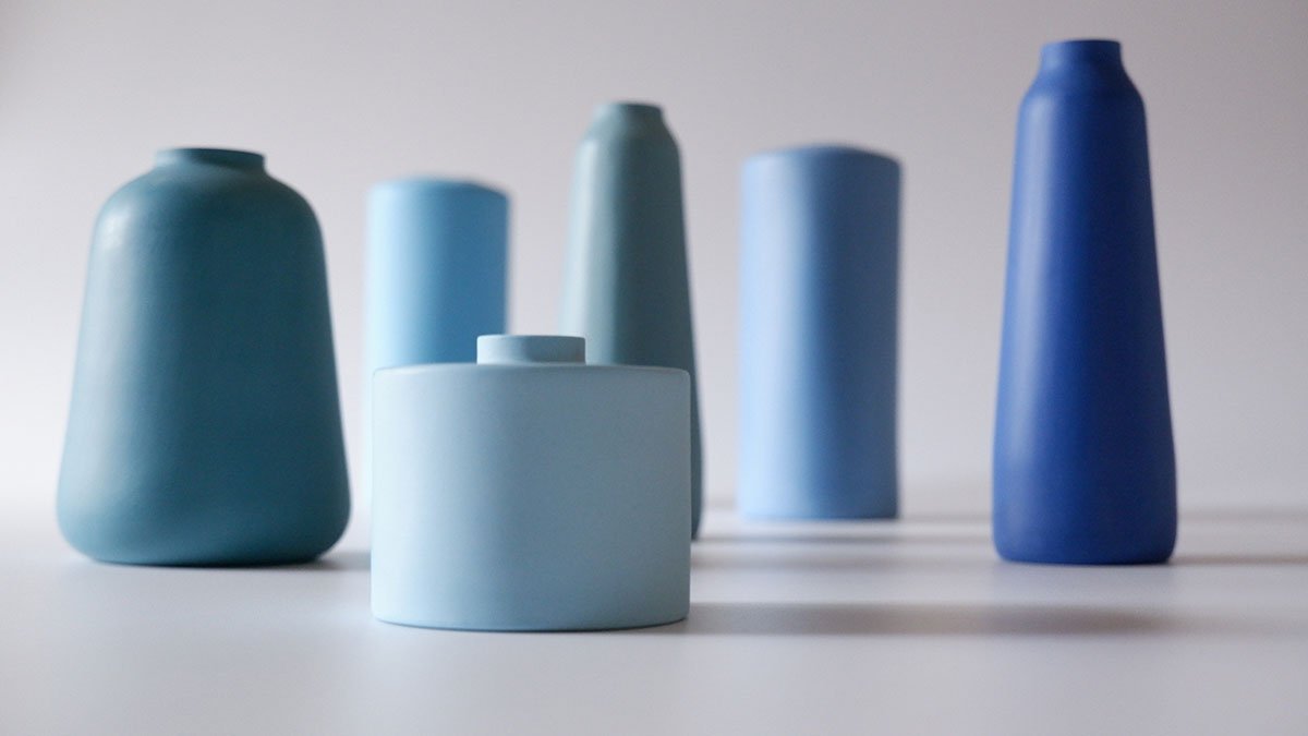 A group of ceramic vessels in various shades of blue