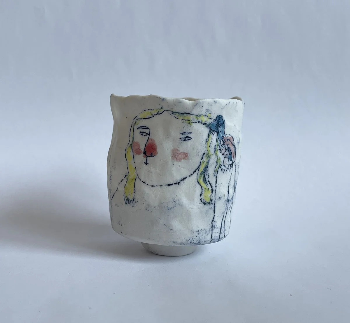 Illustrated ceramic cup