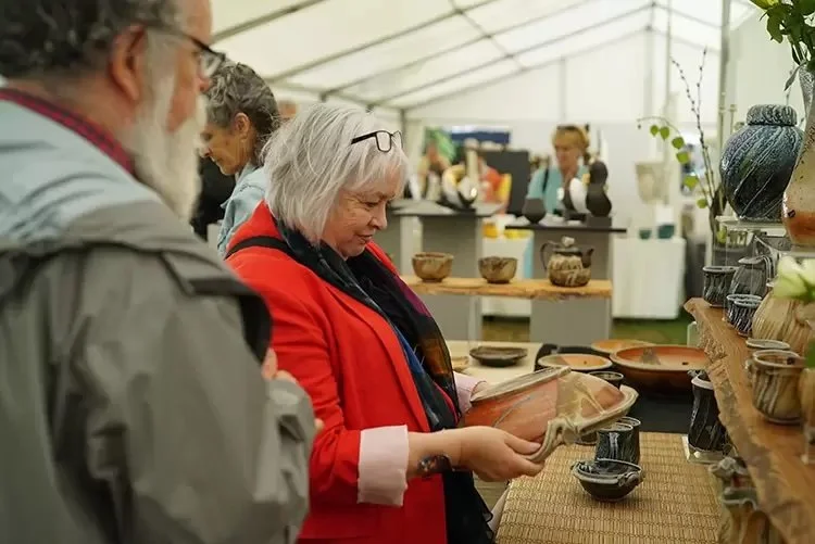 People looking at ceramics