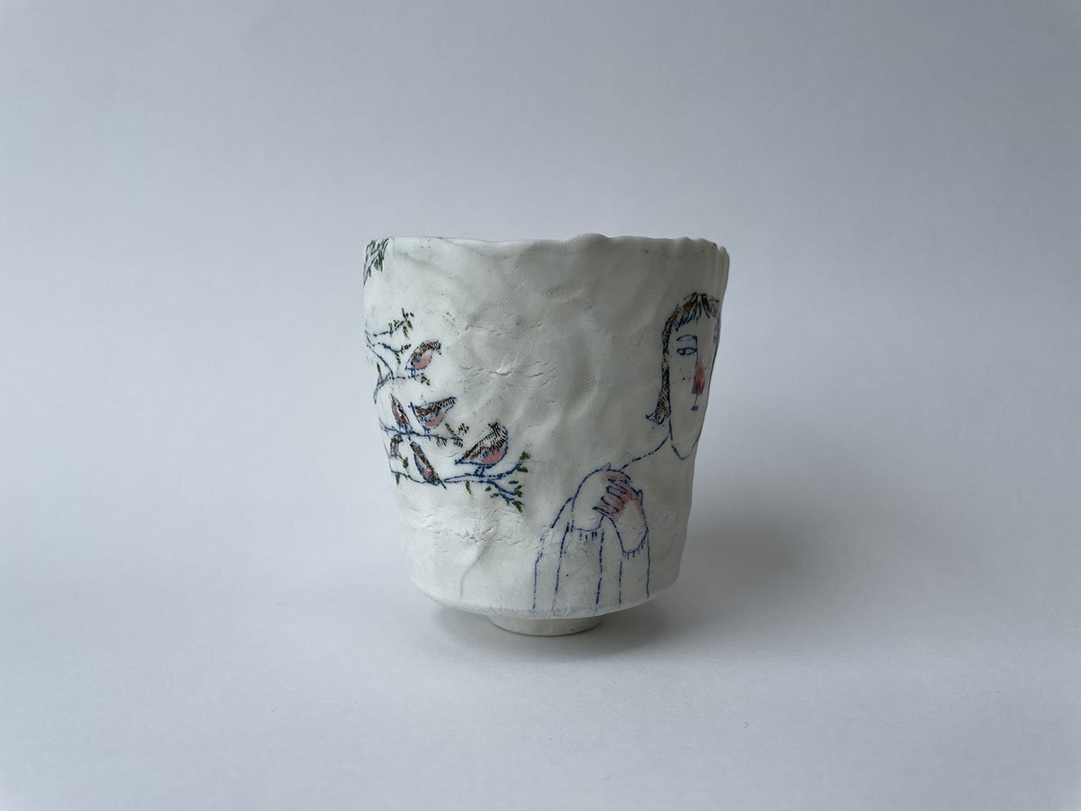 Illustrated ceramic cup