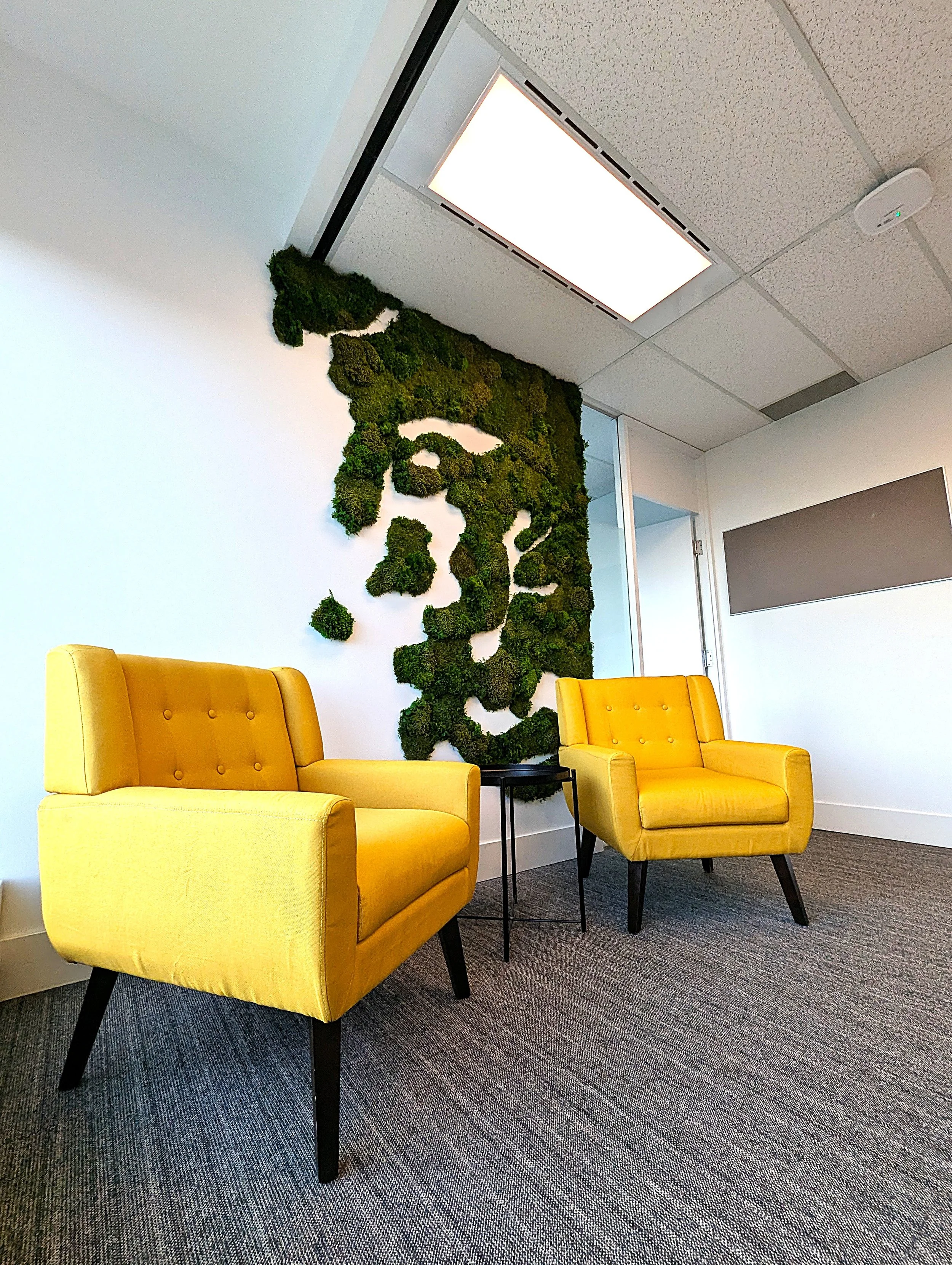A living-inspired installation designed to soften and elevate a communal workplace environment.