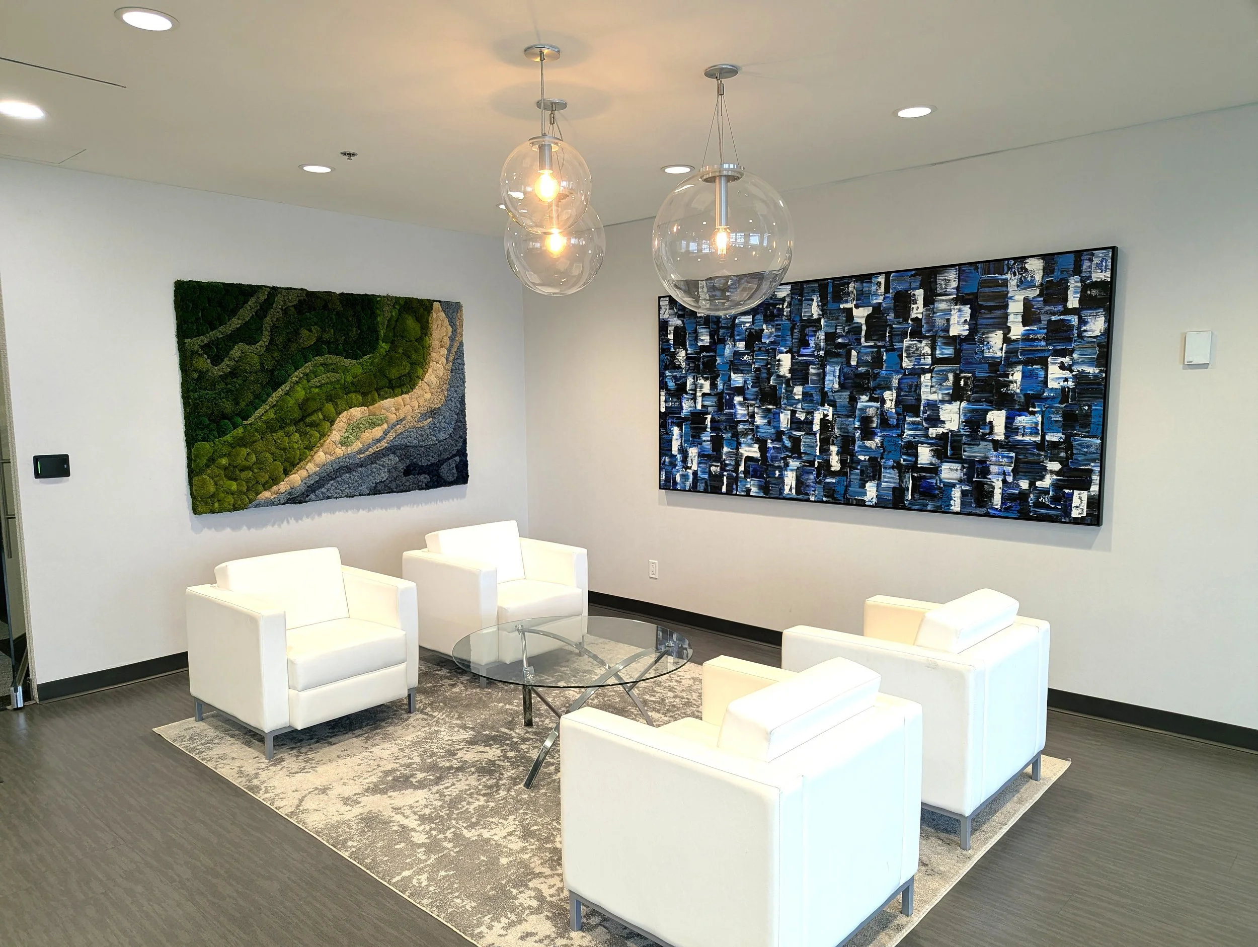 A sculptural moss installation designed to anchor a corporate lobby through colour and texture.