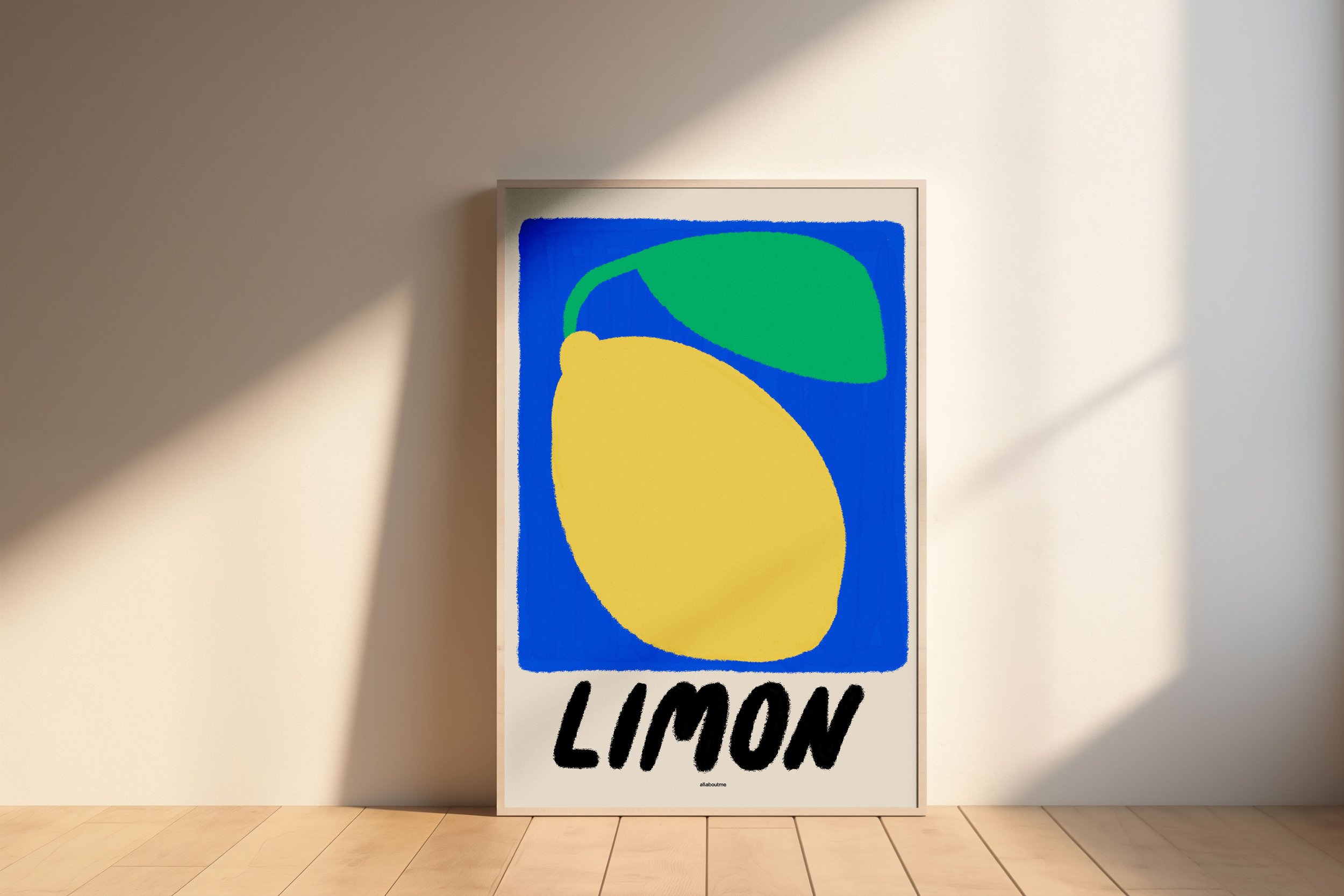 Limon' art print featuring a large yellow lemon with a green leaf on a bold blue background, leaning against a sunlit wall.