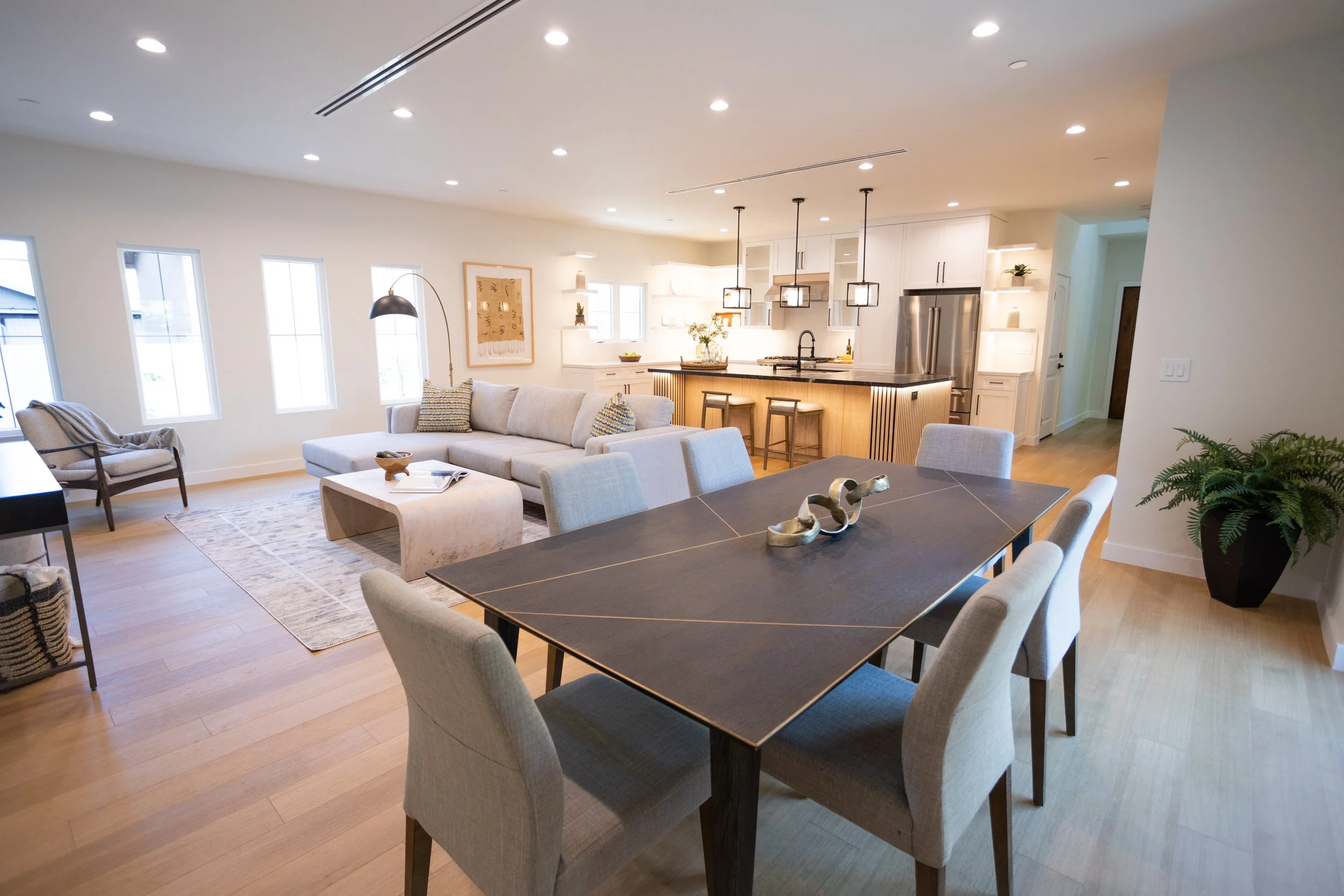 Open-plan living and dining room with a vaulted ceiling