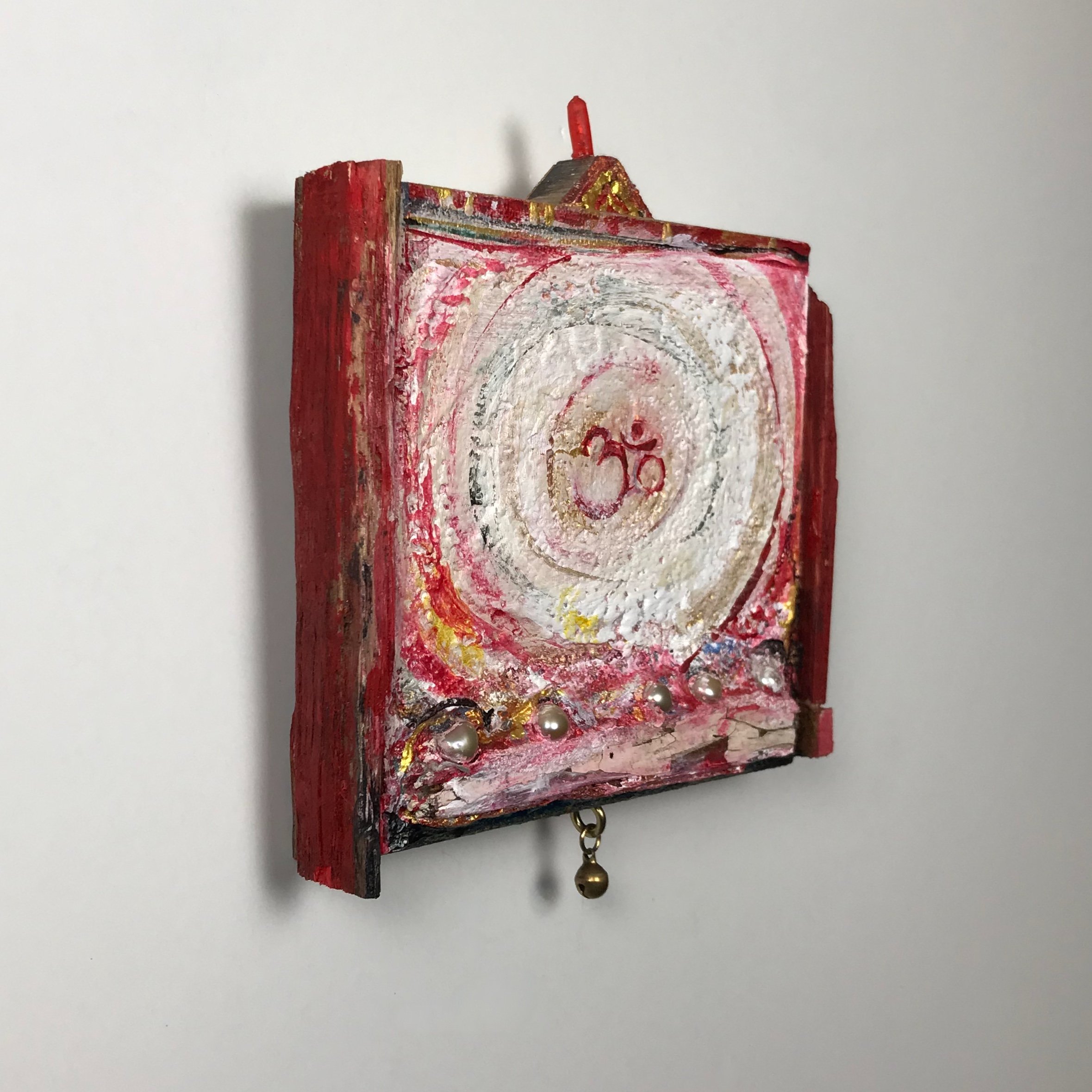 Laura-Trisiano-Om-2-5.5_hx4.5_wx1_d-one-of-a-kind-mixed-media-found-object-painting-art-reclaimed-upcycled-old-wood-freshwater-pearls-red-plastic-finial-paint- aum-mantra-universal-sound- (1).jpeg