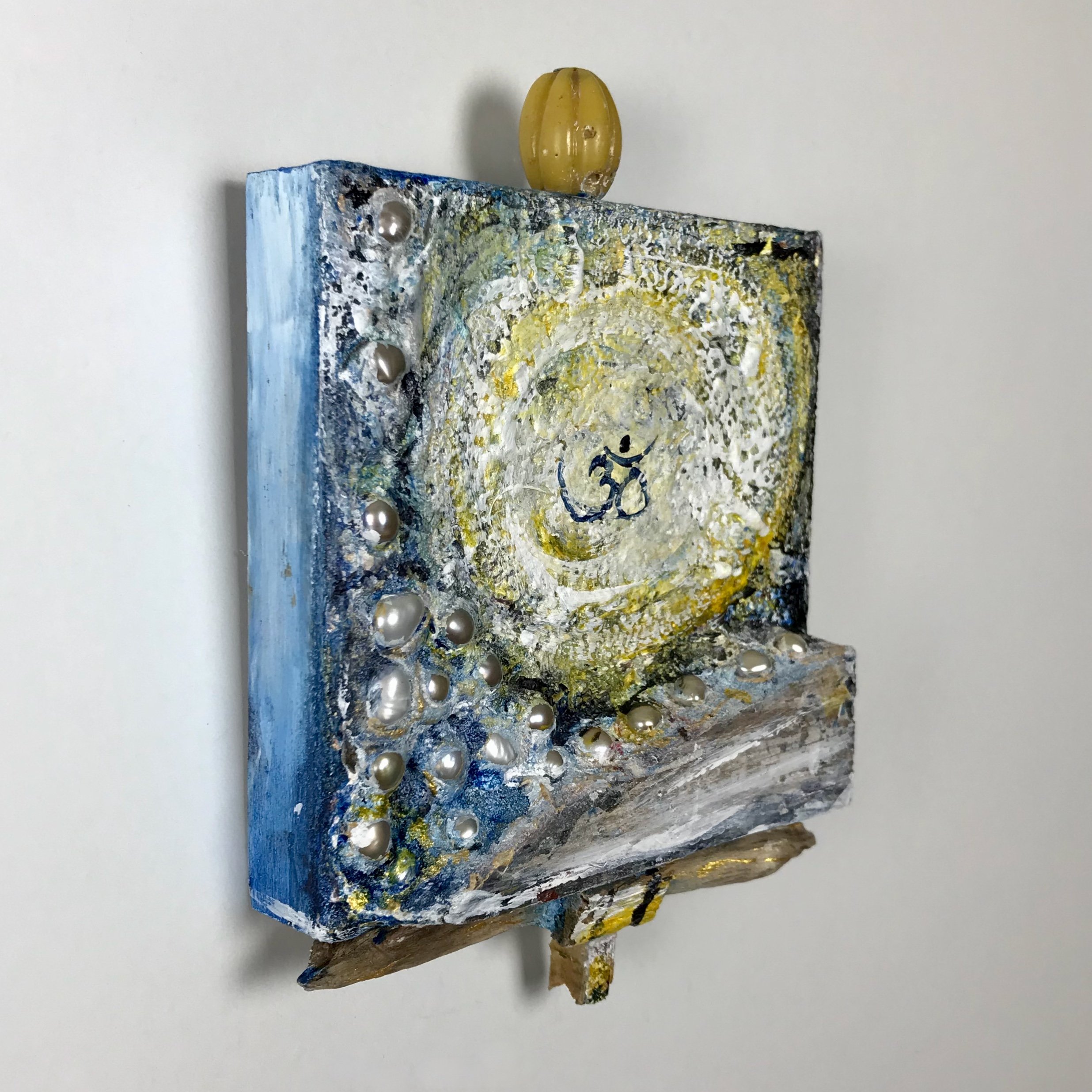 Laura-Trisiano-Om-7-5.75_hx4_wx1_d-one-of-a-kind-mixed-media-found-object-painting-art-reclaimed-upcycled-old-wood-freshwater-pearls-yellow-carnelian-bead-paint- aum-mantra-universal-soun (1).jpeg