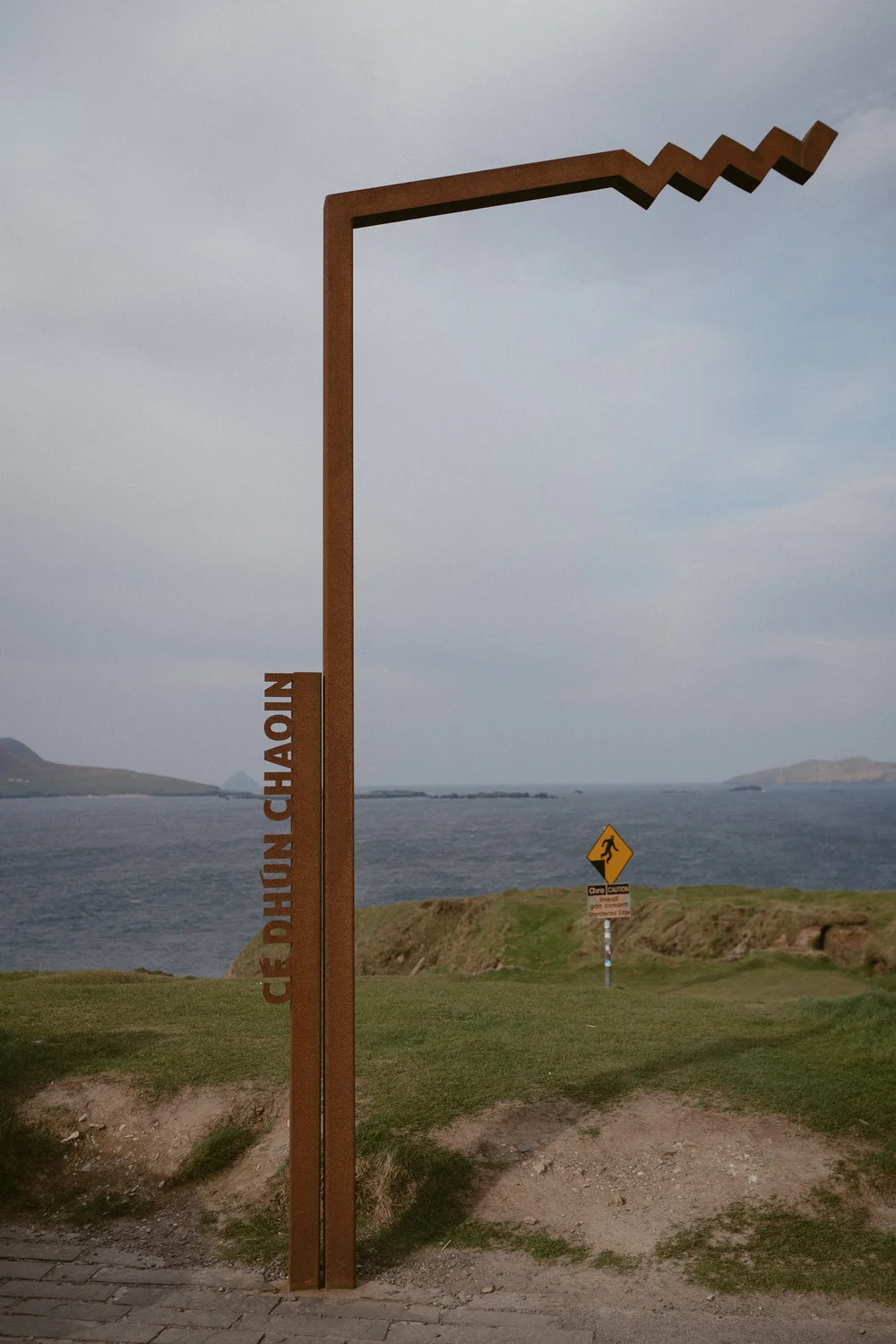 Mollie and Ryan standing together at Dunquin Pier, Dingle, on their elopement day