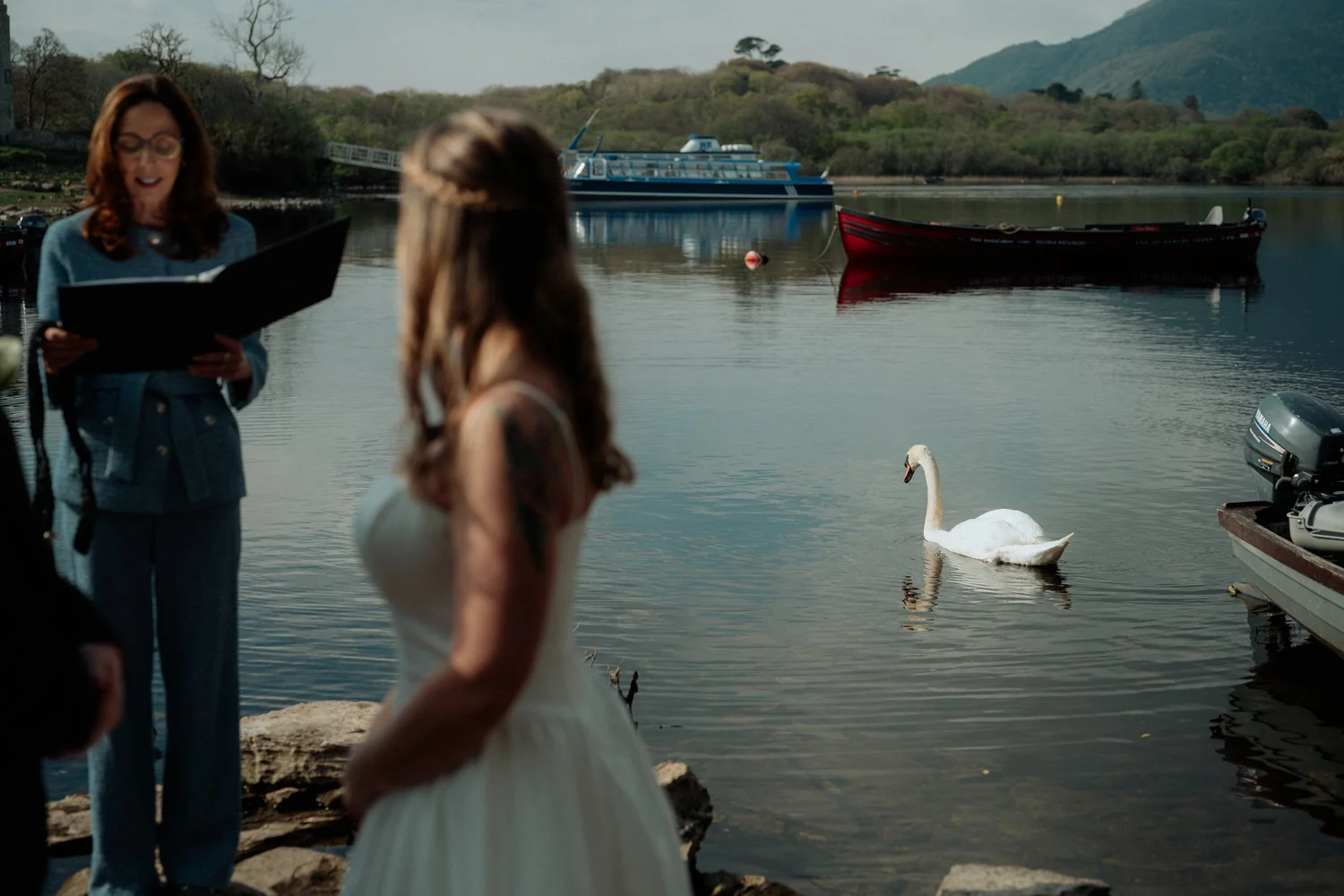 The couple walking together along the lakeshore at Ross Castle, Co. Kerry