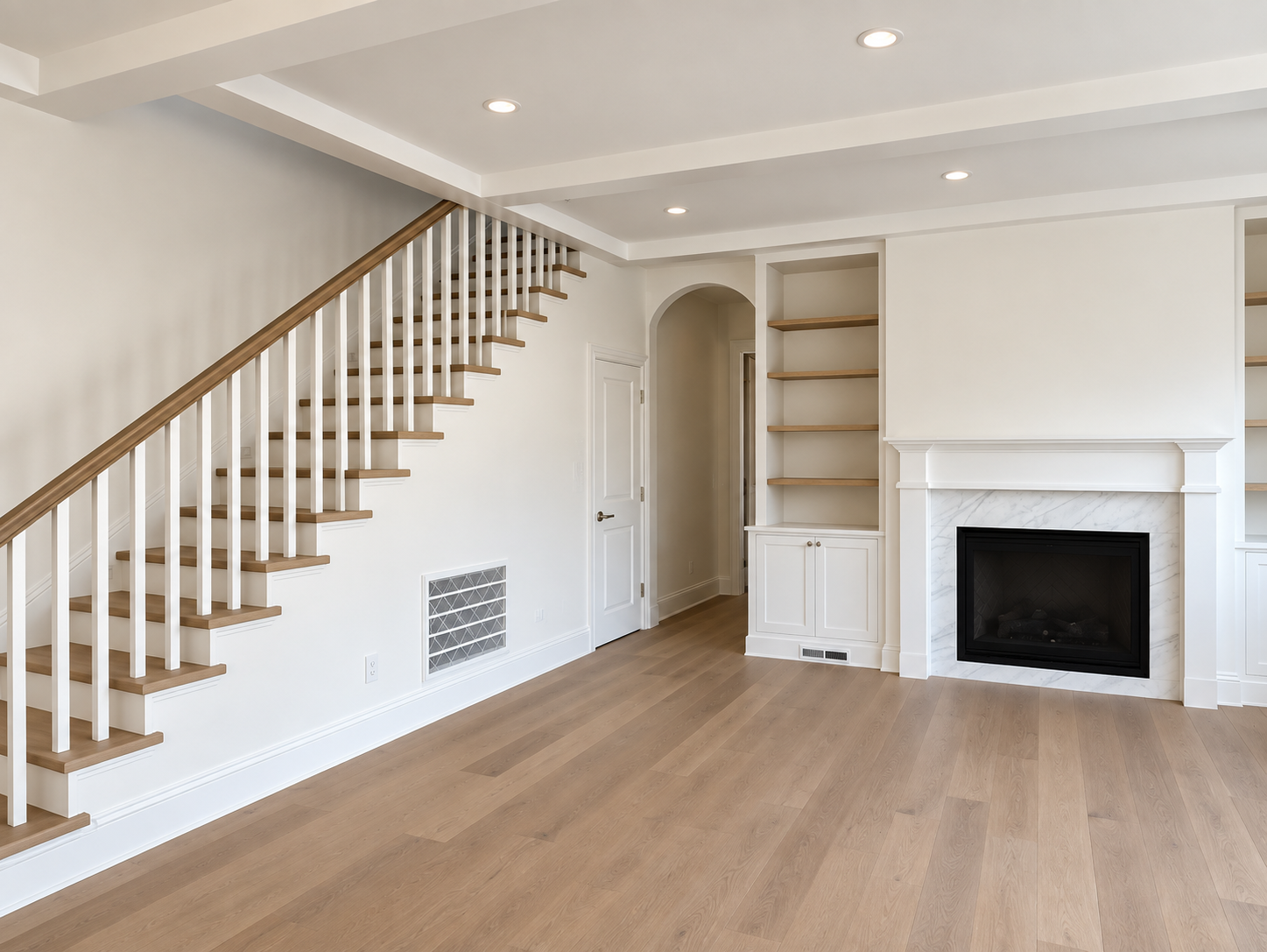 Living room with a staircase, fireplace, and built-in shelving at Edgewood Park.
