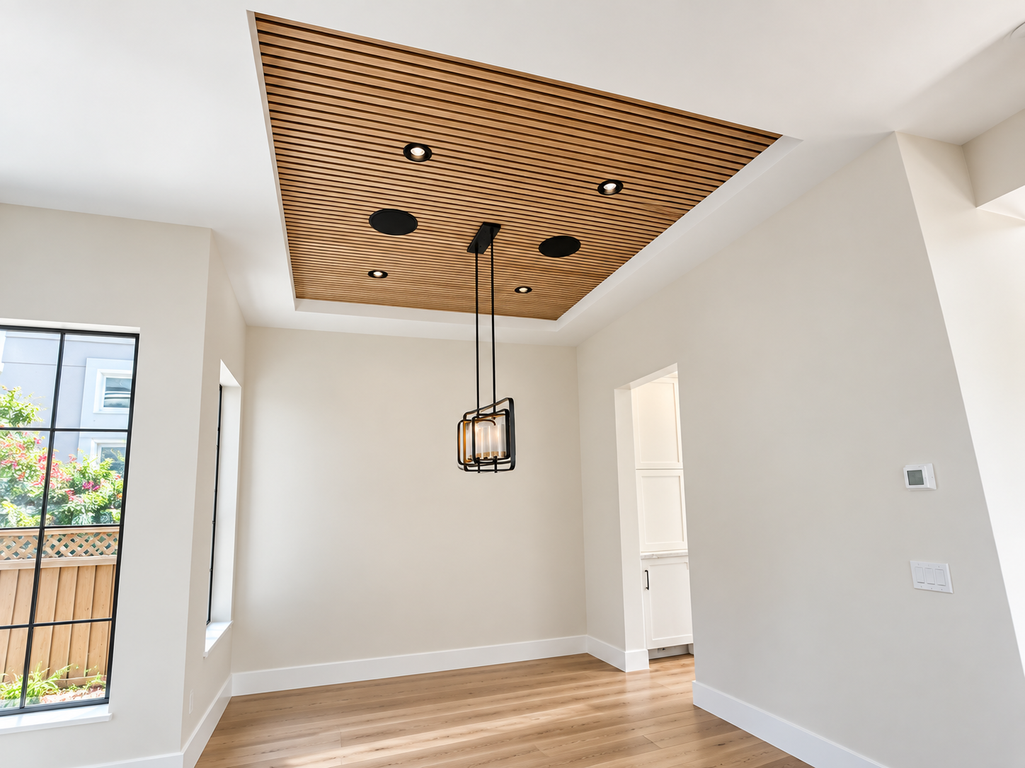 Recessed wood dining-room ceiling in BG Design Build's contemporary San Mateo home remodel.