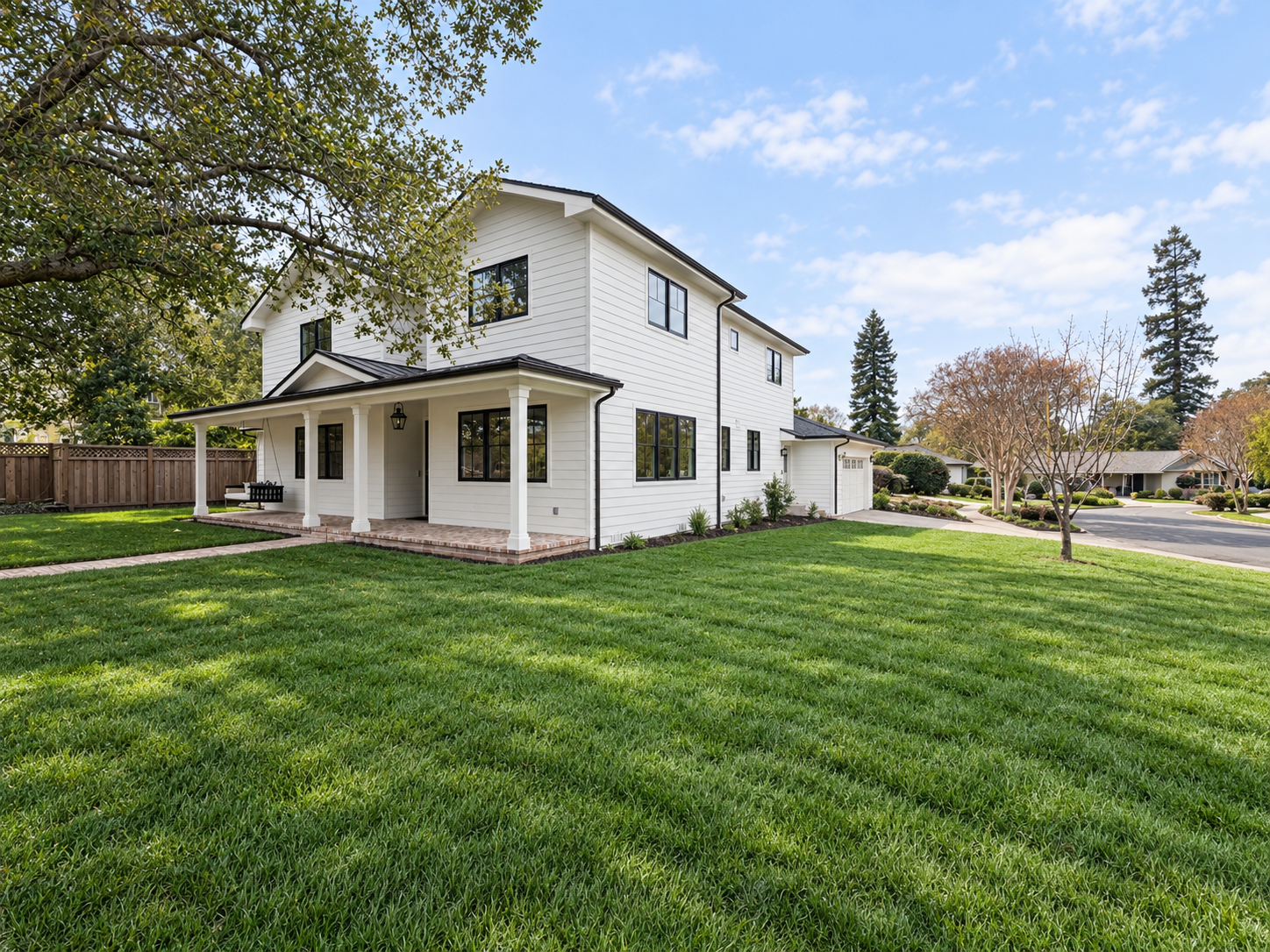 Side exterior and lawn at the two-story Edgewood Park custom home.