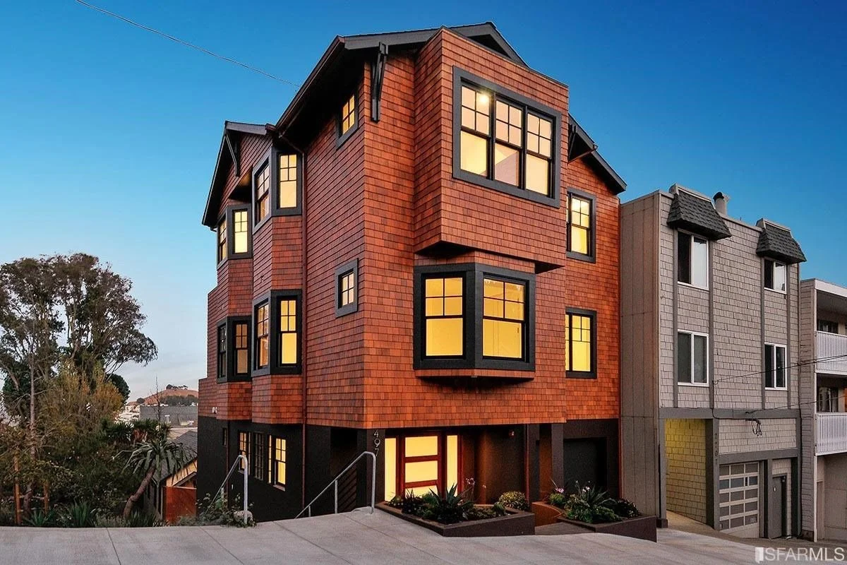 Red-clad Valley Street custom home with black-framed windows in Noe Valley, San Francisco.