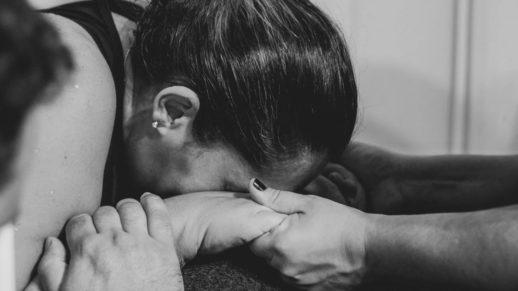 Laboring woman supported by Sarah Austin in Annapolis, MD.