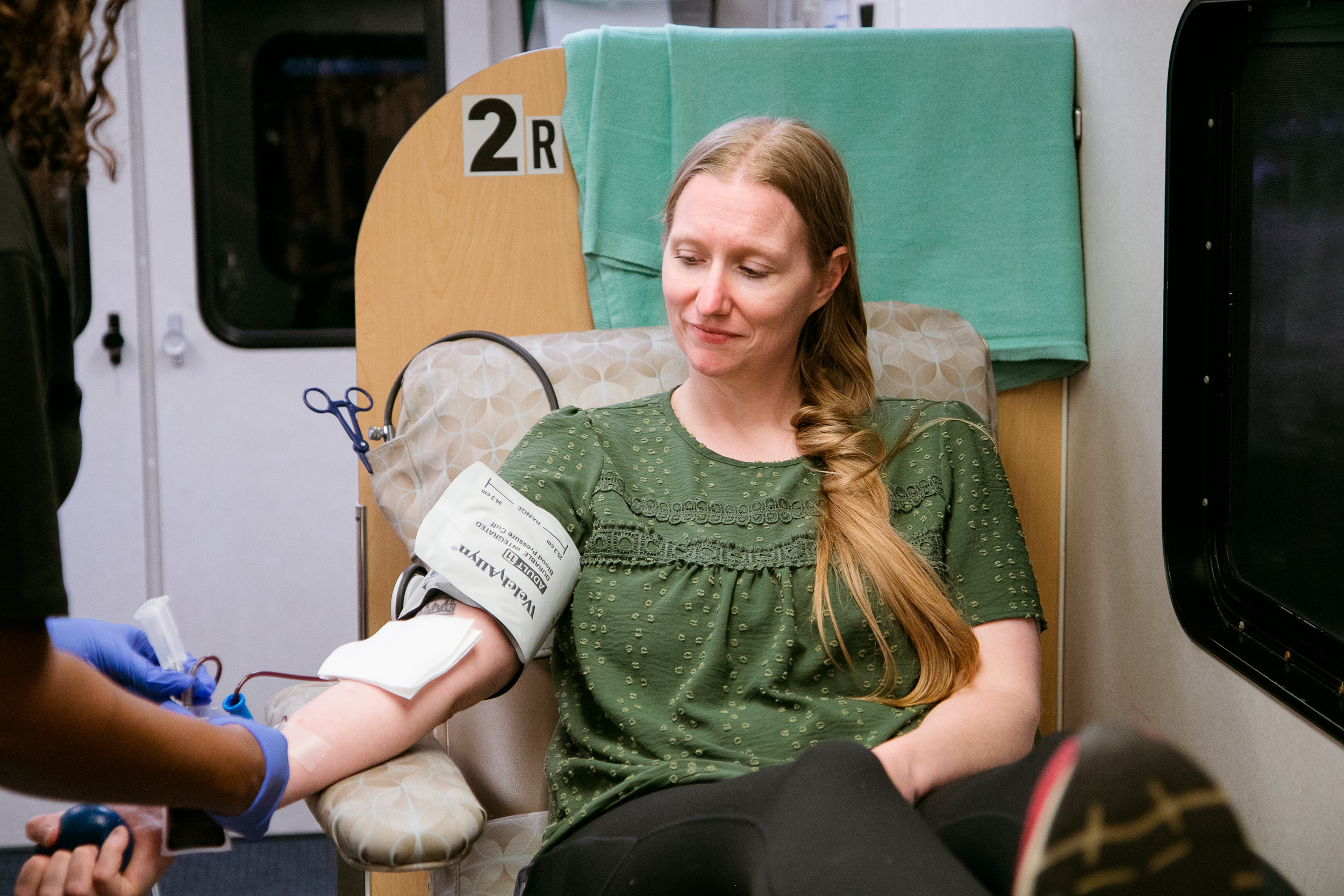 Sarah Austin, birth doula, giving blood.
