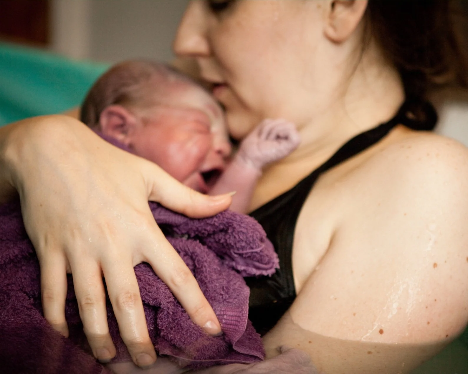 Empowered woman caught her own baby during a home water birth in Annapolis, MD.