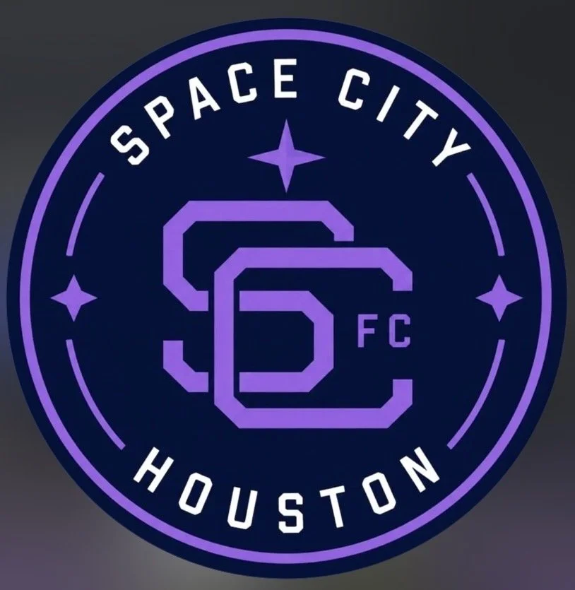 A circular logo with a dark background and purple outline, displaying the words 'SPACE CITY HOUSTON' around the perimeter. The center features a stylized 'S' and 'C' intertwined with the letters 'FC'.