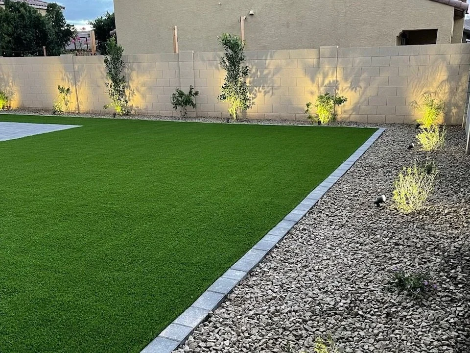 Backyard outdoor lighting and turf installation services near Phoenix, Arizona by Green Garden Lawn Services.