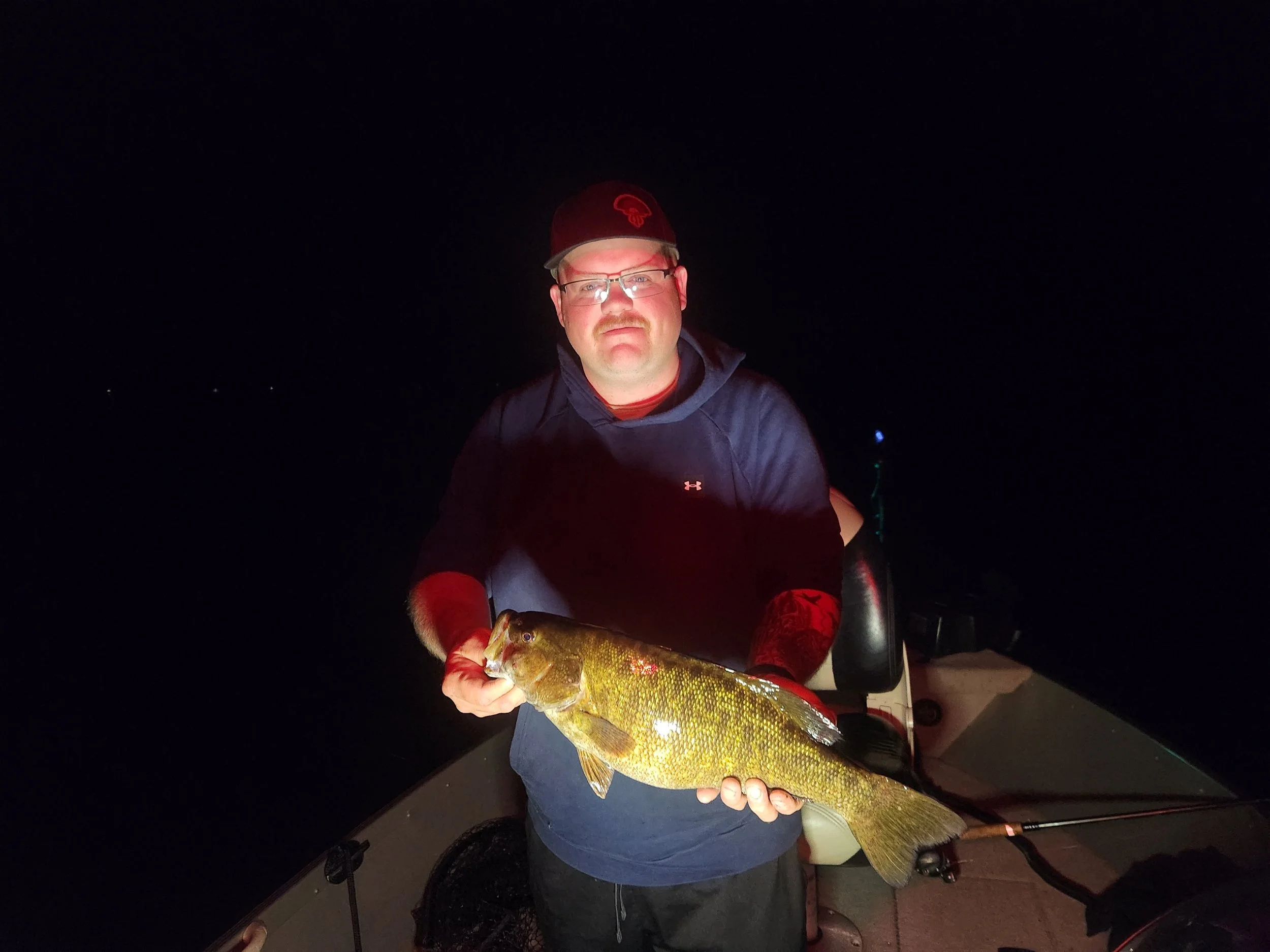 Zach with a beautiful late night smallmouth 