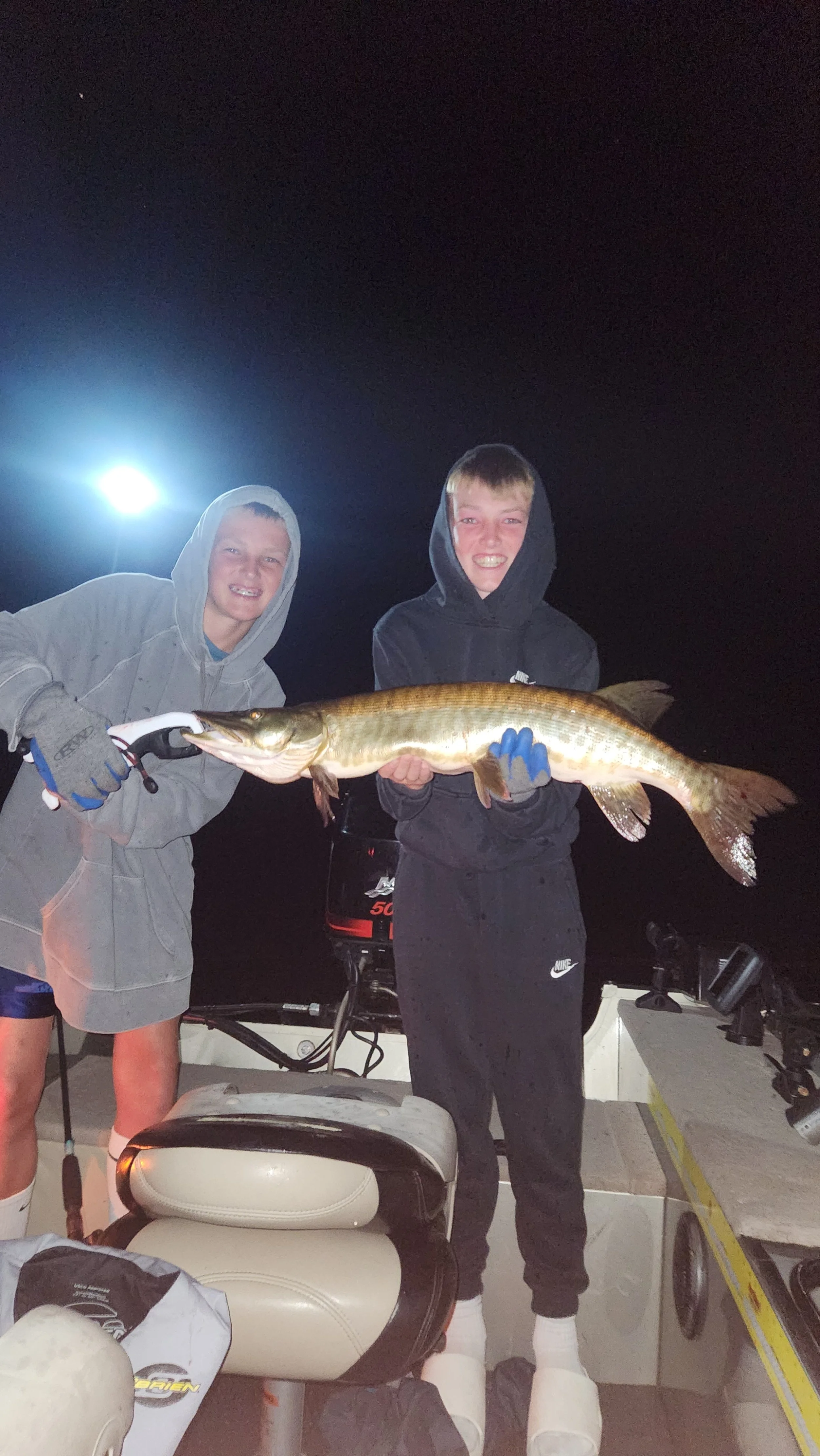 Drew and Luke posing with a musky that struck near the boat at the end of the night!