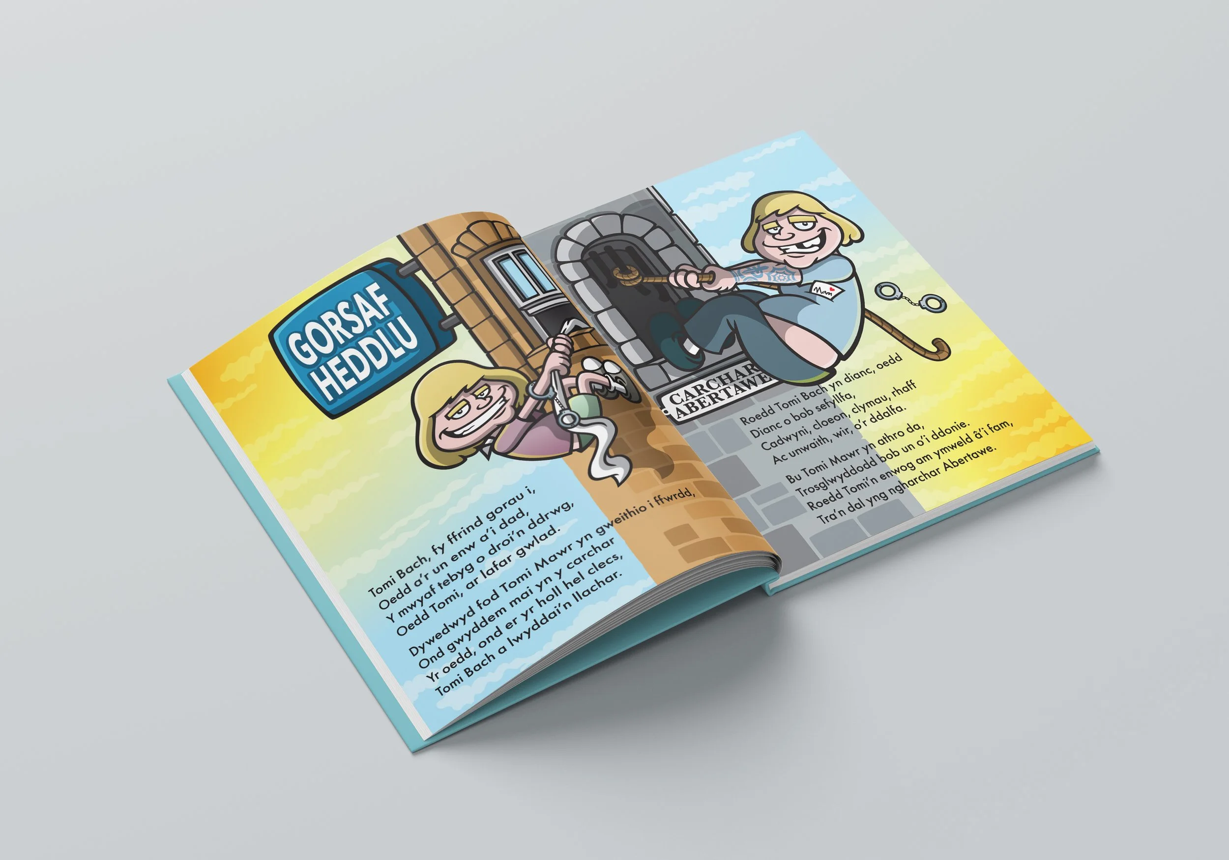 An open book with colorful cartoon illustrations and text in Welsh. The left page features a girl holding a snake and a sign that says "Gorsaf Heddl". The right page shows a girl sitting on a medieval-style window ledge with a chain attached, and a p