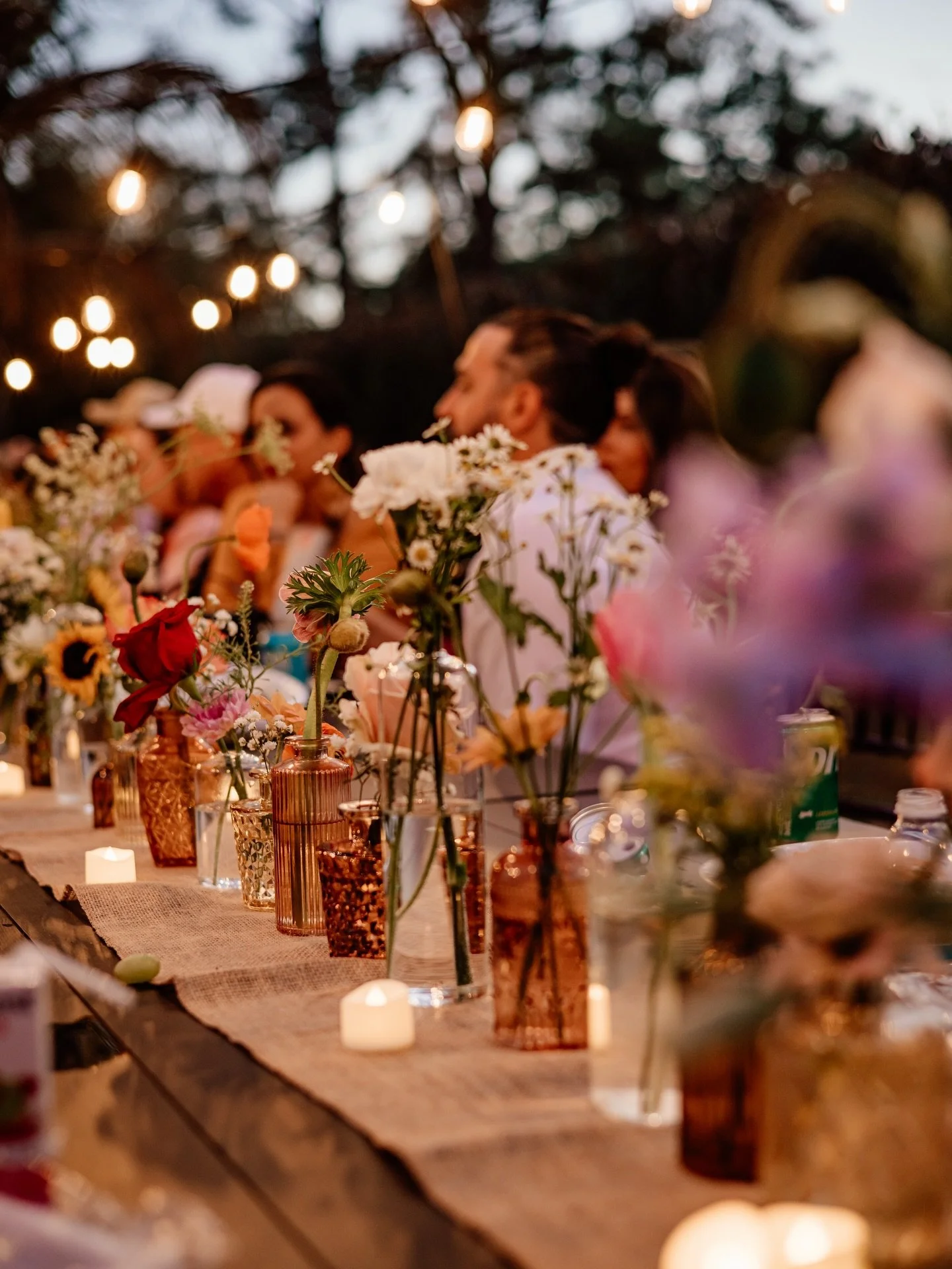 Layered, garden style florals set the tone for this magical, twinkly-lit evening. The warm splashes of color against the sunset sky and whispy accents in the early spring breeze made for the most whimsical &amp; meaningful vow renewal ceremony 🌸 🌅
