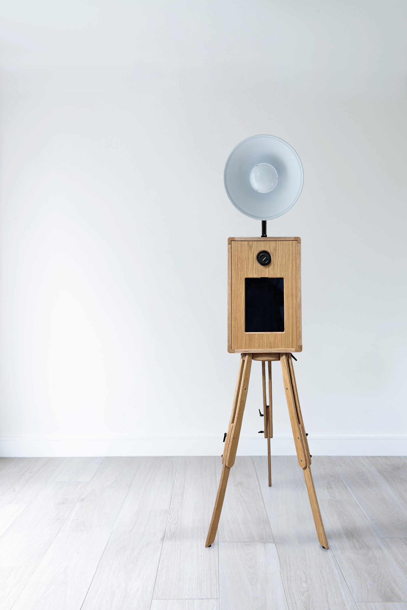 It’s Social Retro Photo Booth setup with wooden tripod and large reflector for events and weddings.