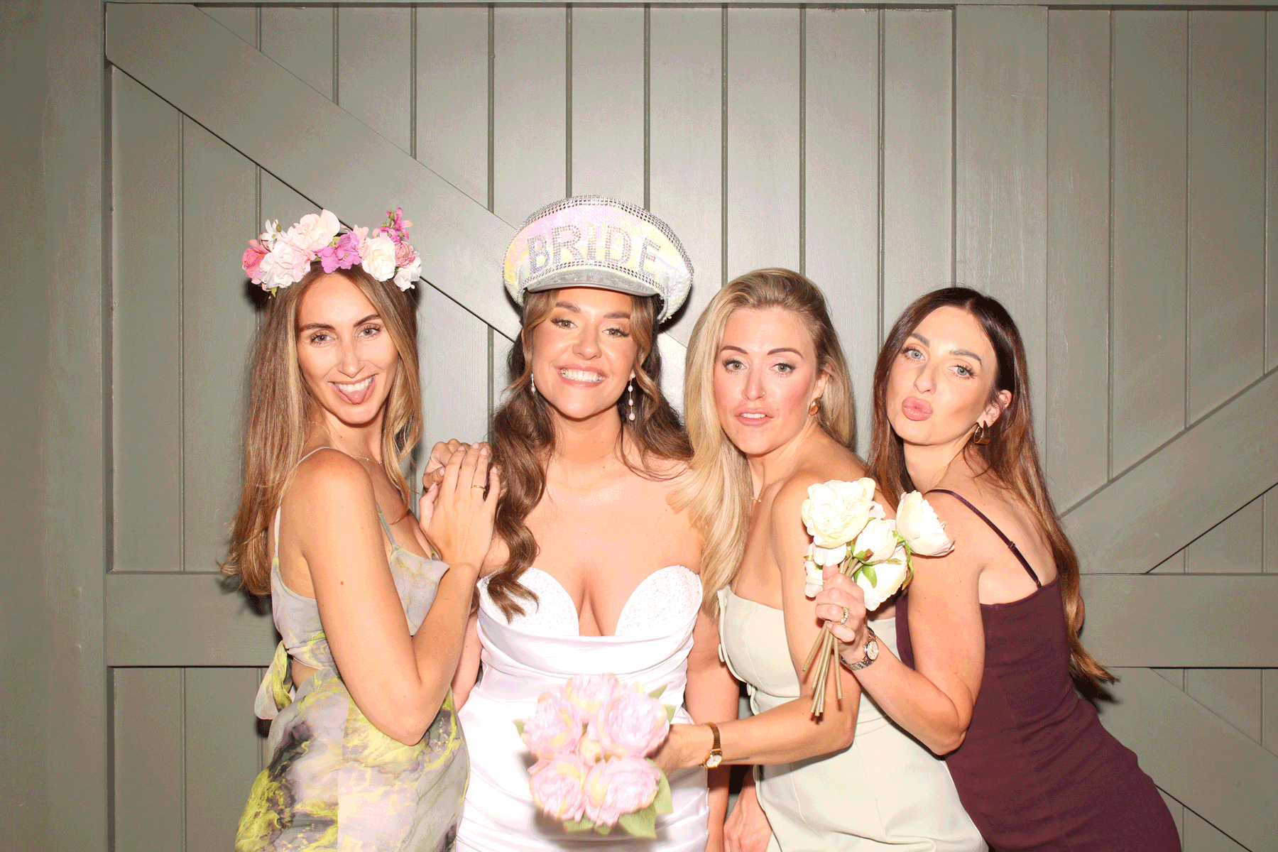 Bride and friends using It’s Social Signature Photo Booth at a wedding celebration.