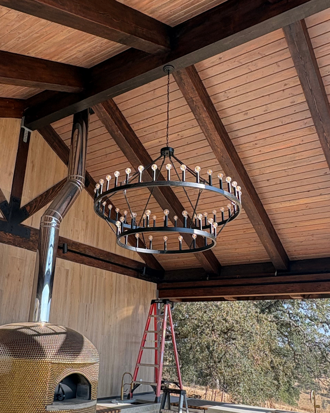 Installed chandelier to an extended vaulted ceiling.