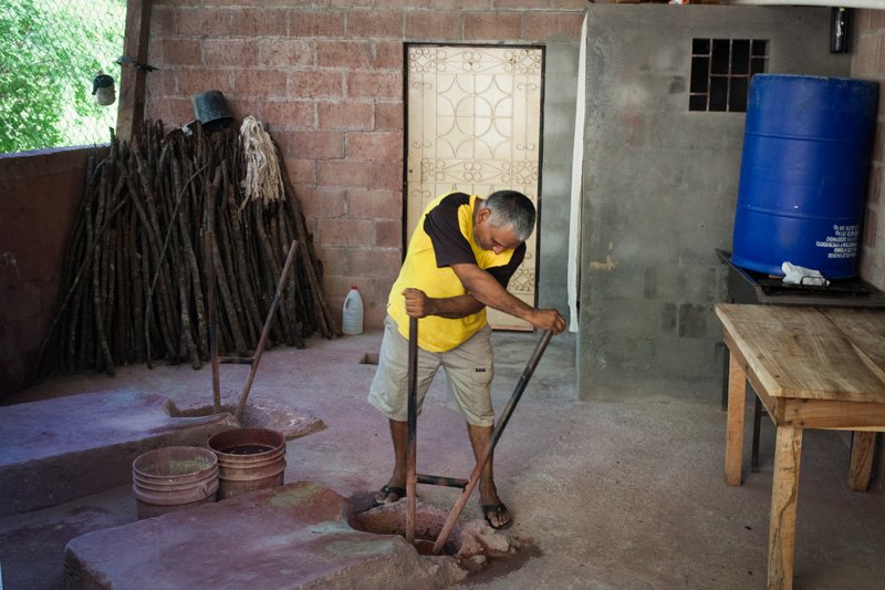 An artisanal gold digger using mercury in his courtyard. El Salvador, 2016