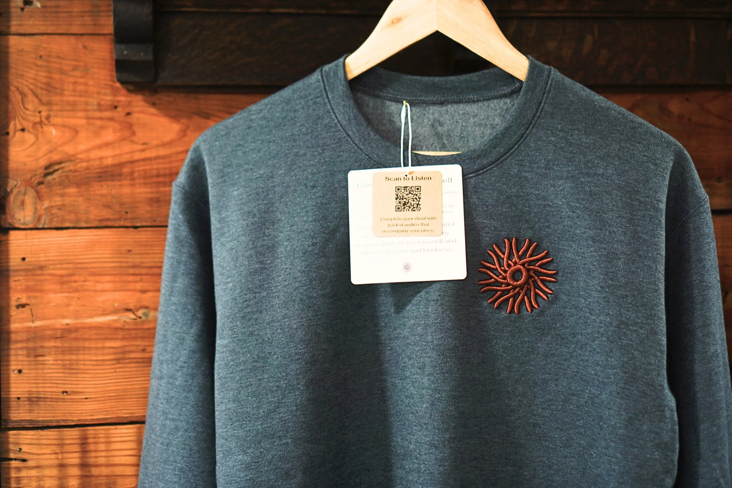 ComeHome_Sweatshirt_Grey_Hanging_CloseUp.jpg