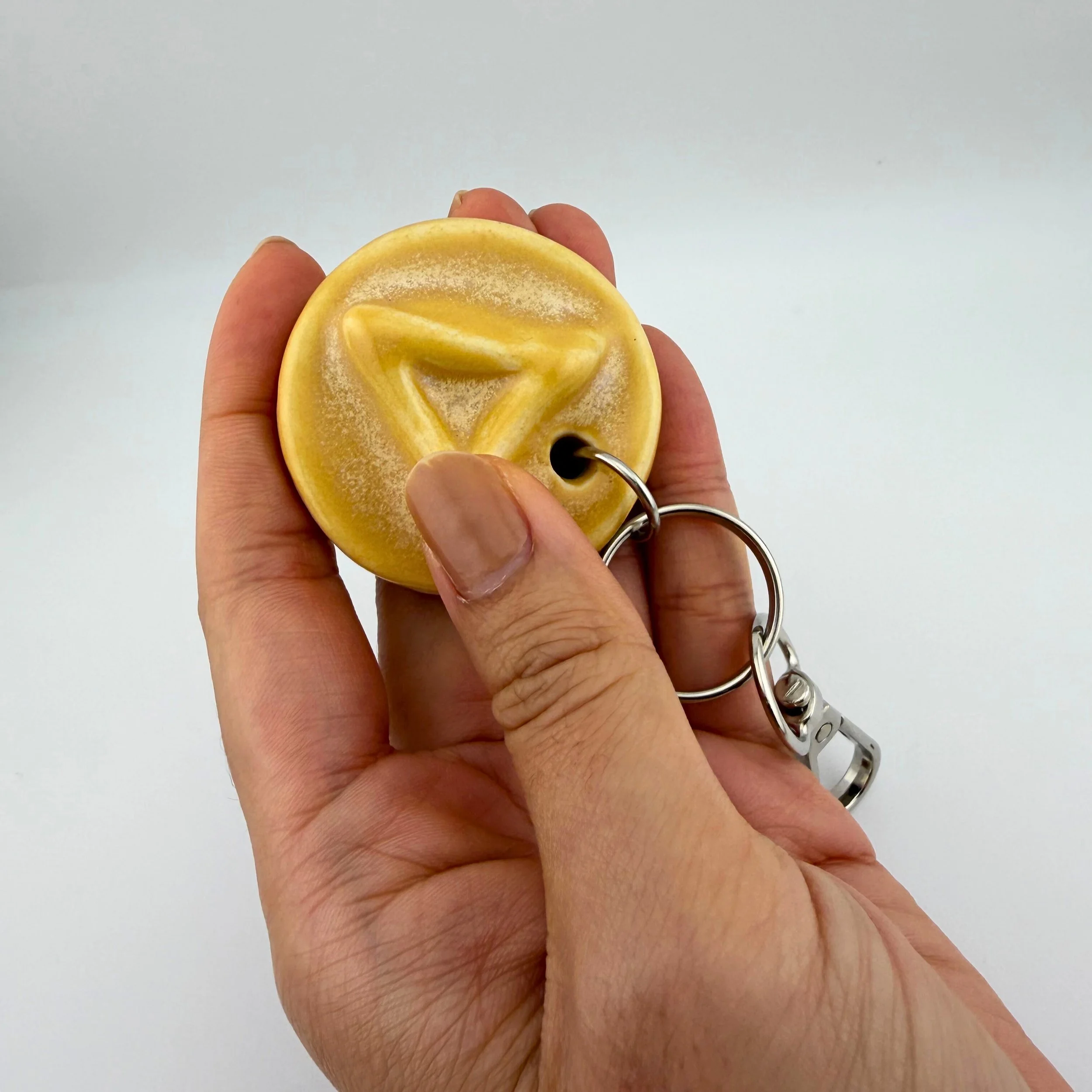 calmware-square-triangle-guided-breathing-keychain-in-use.jpg