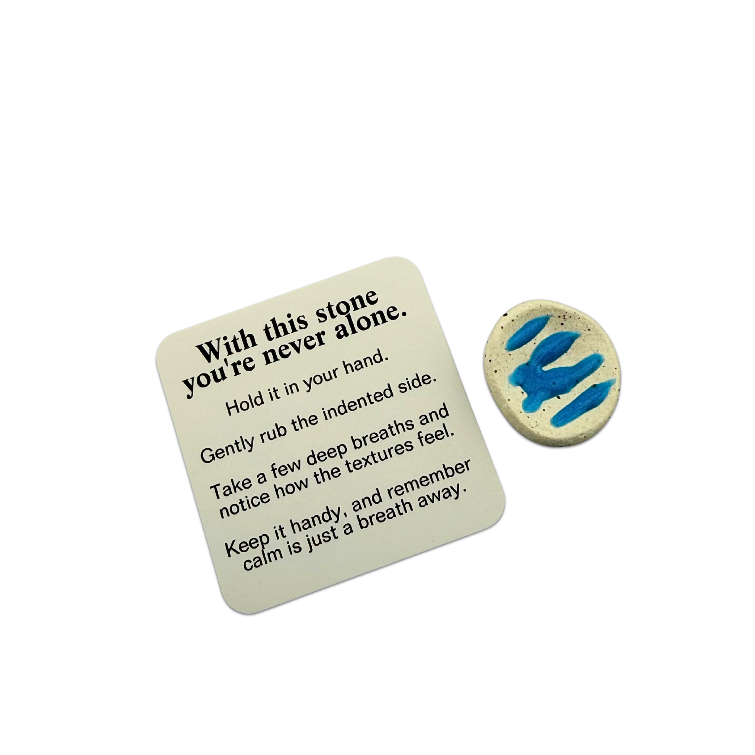 calmware-gloop-worry-less-stone-with-ritual-card-flatlay.png