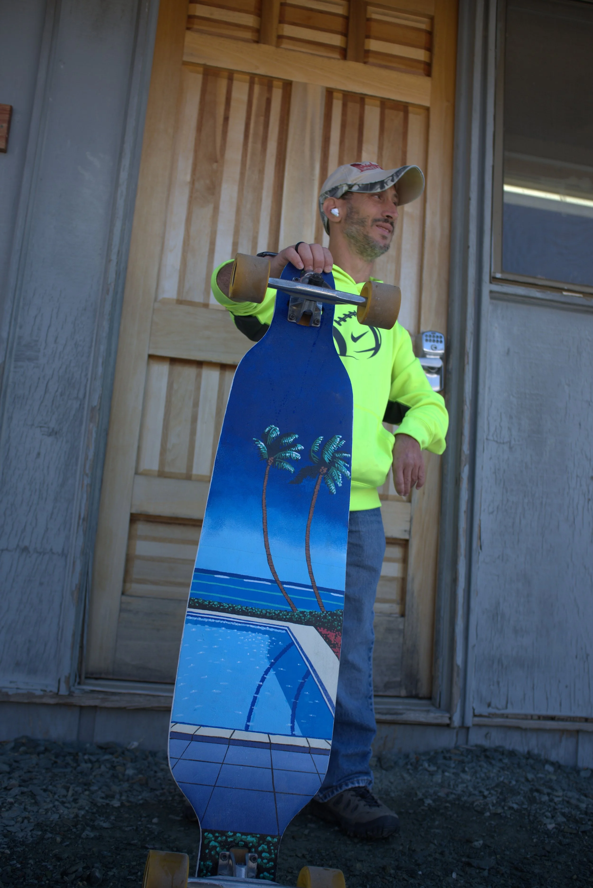 Kevin holding a painted board