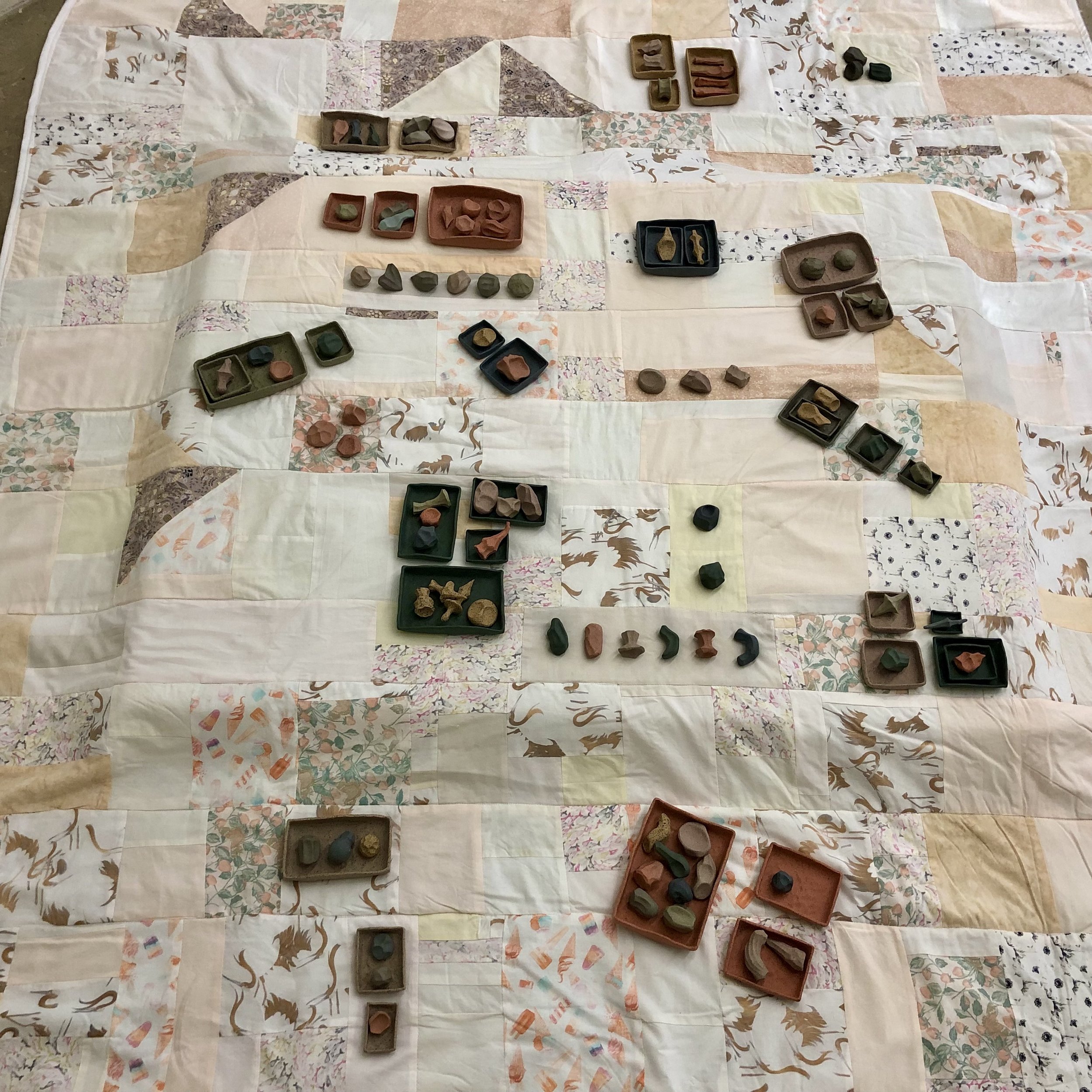 "Play Blanket,"
90" x 84," ceramic, bleached fabric, 2023