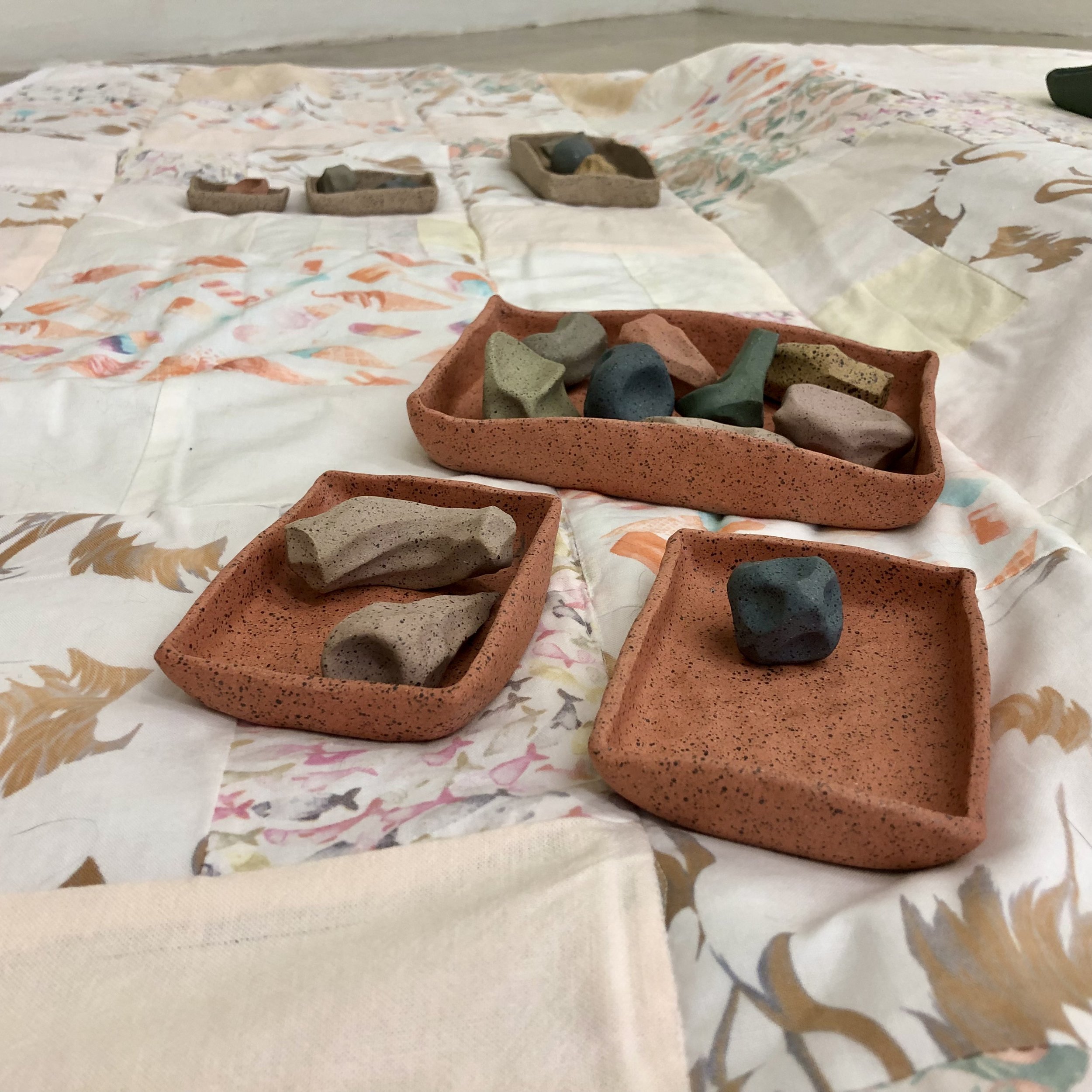 "Play Blanket,"
90" x 84," ceramic, bleached fabric, 2023