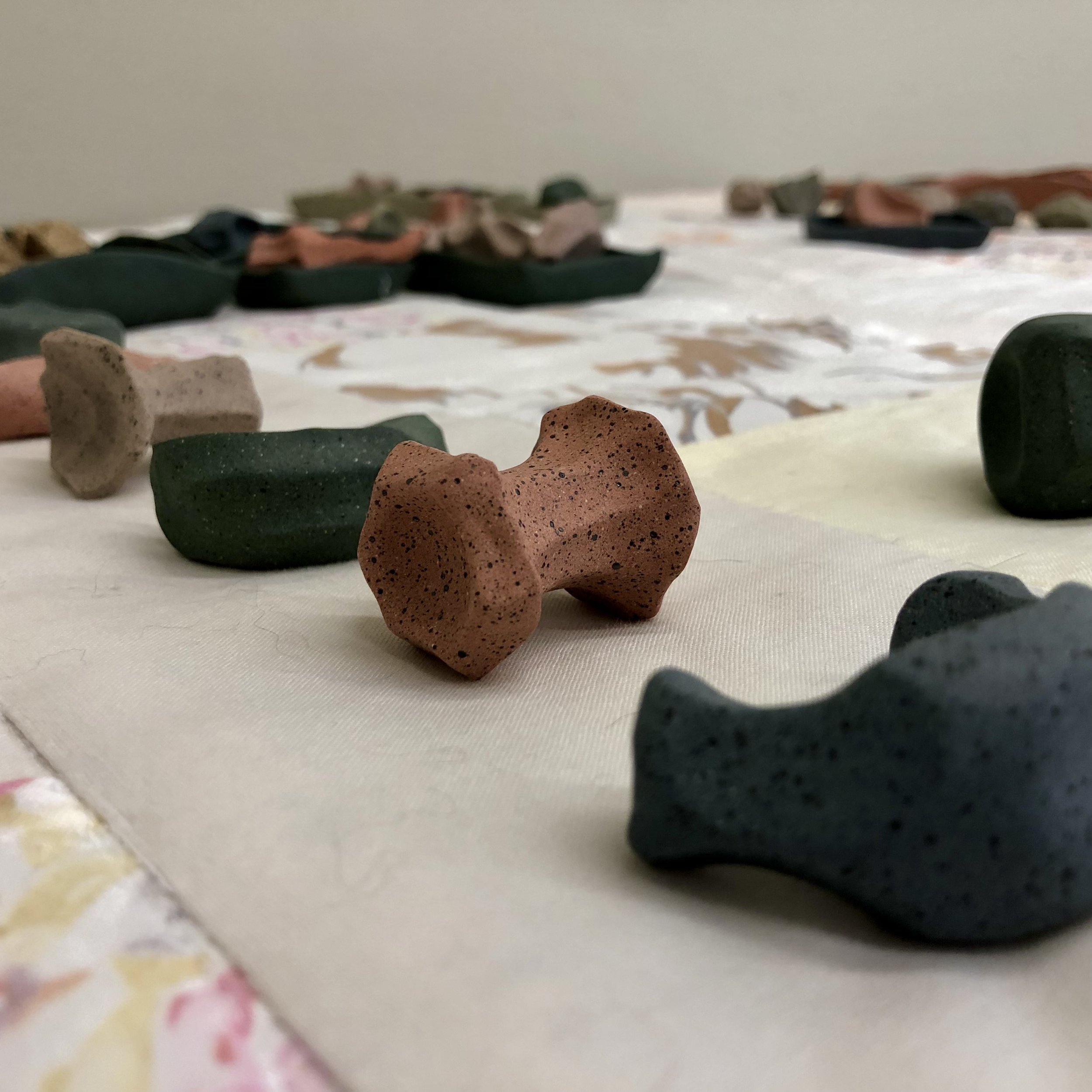 "Play Blanket,"
90" x 84," ceramic, bleached fabric, 2023