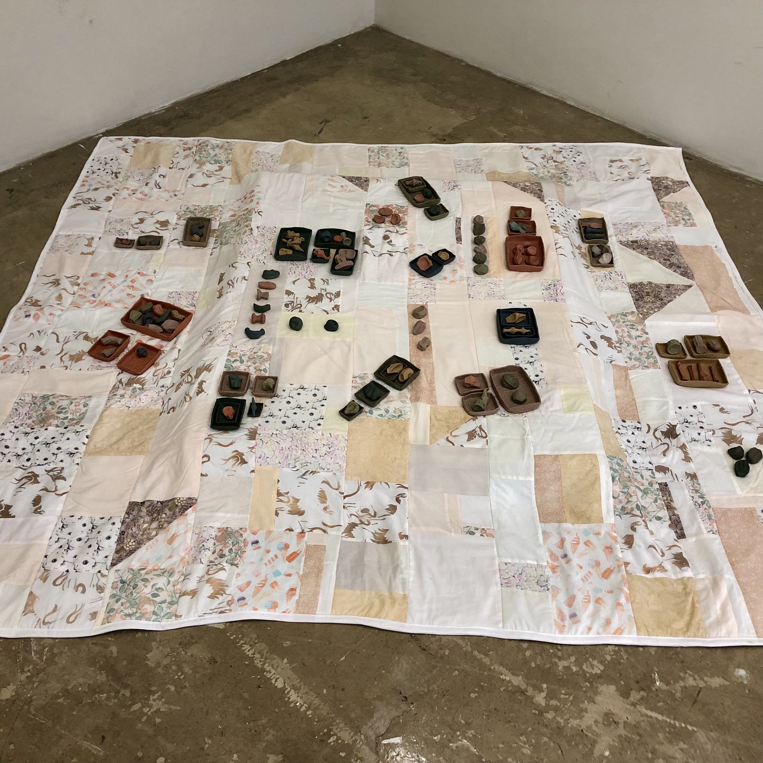 "Play Blanket,"
90" x 84," ceramic, bleached fabric, 2023