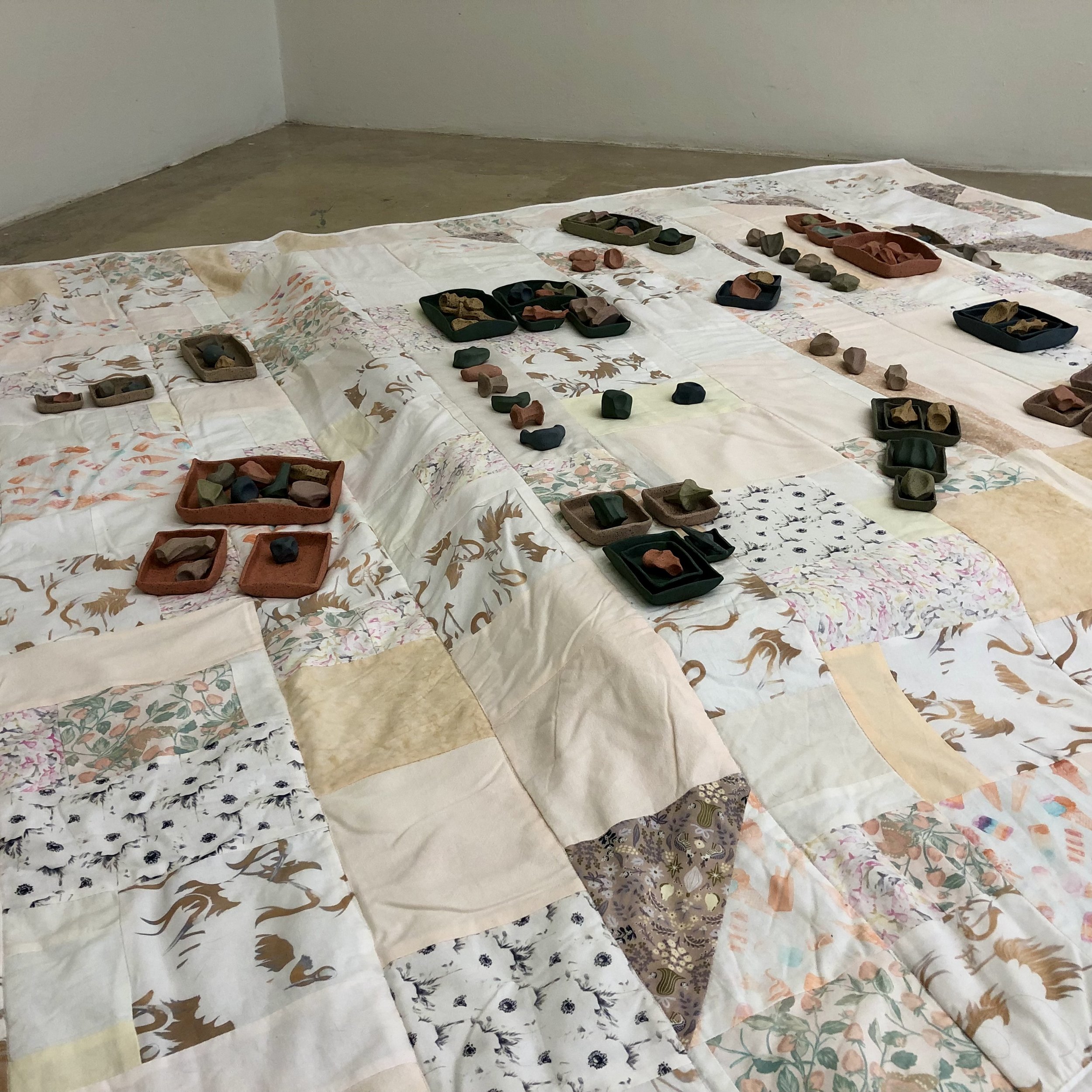 "Play Blanket,"
90" x 84," ceramic, bleached fabric, 2023