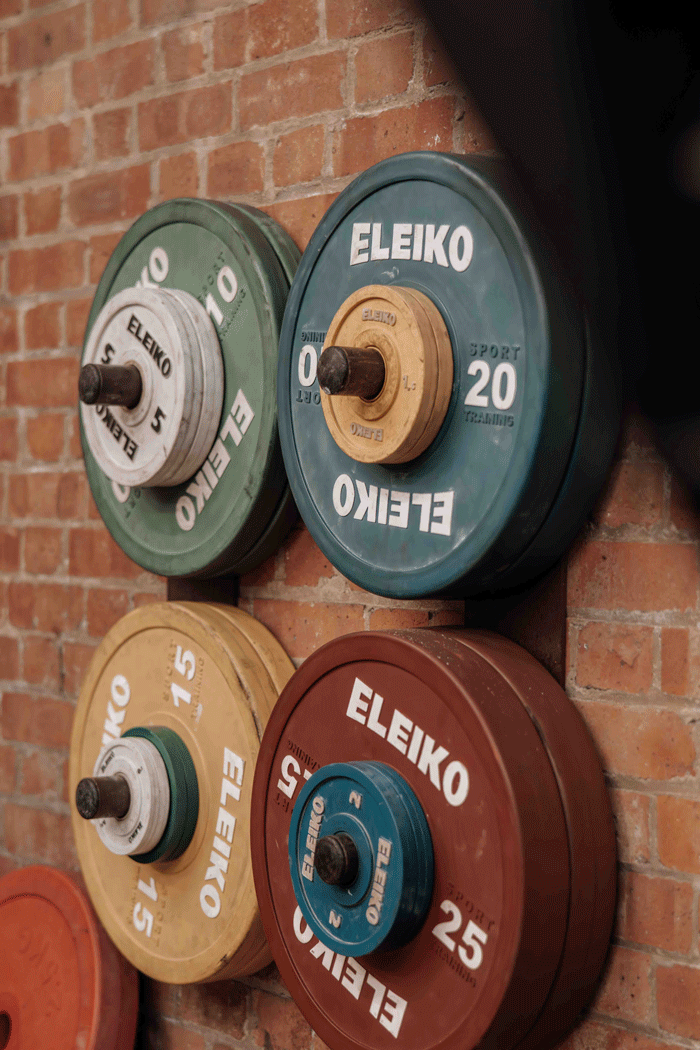 Weights on a wall in a gym