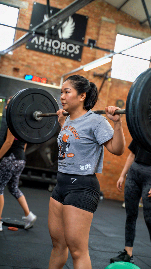 Female weightlifting in a CrossFit gym