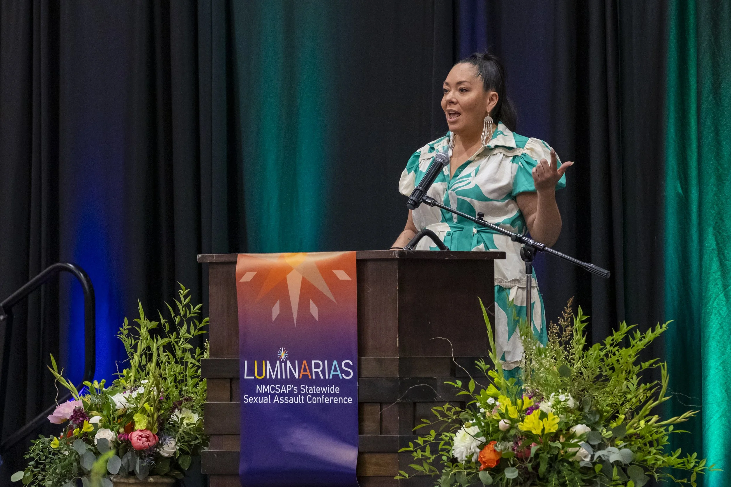 A woman speaking at a podium