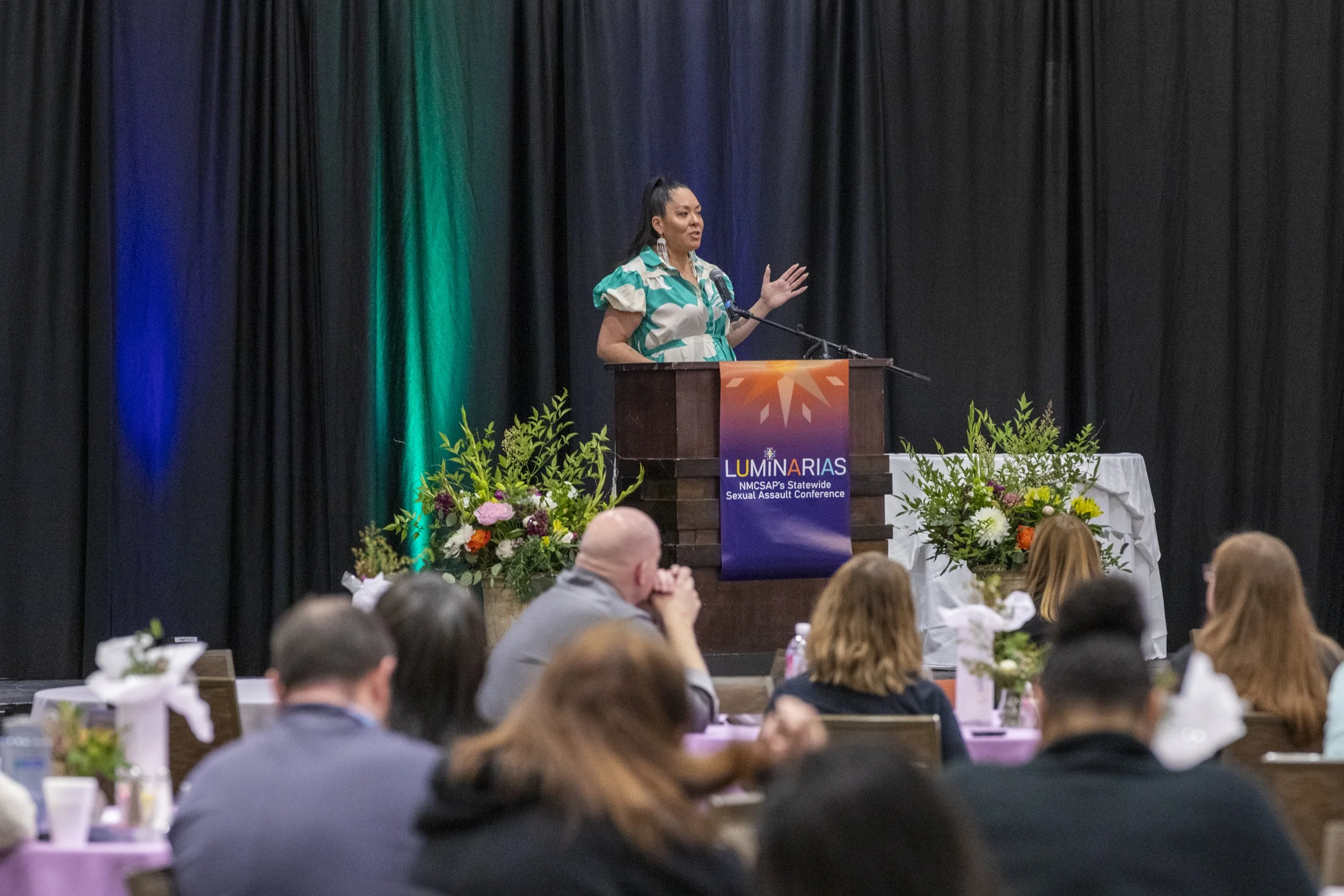 A woman speaking at a podium
