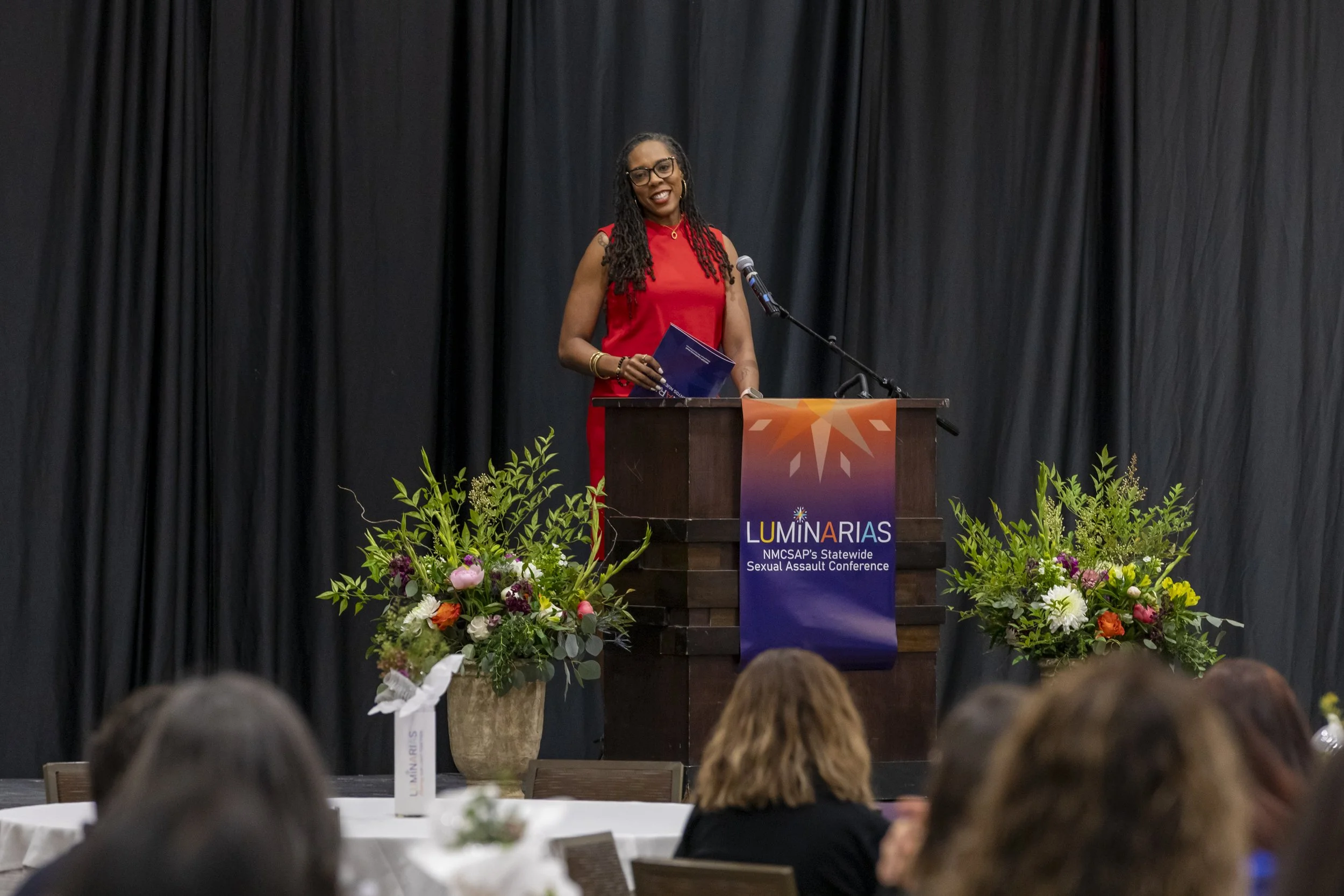 A woman standing at a podium