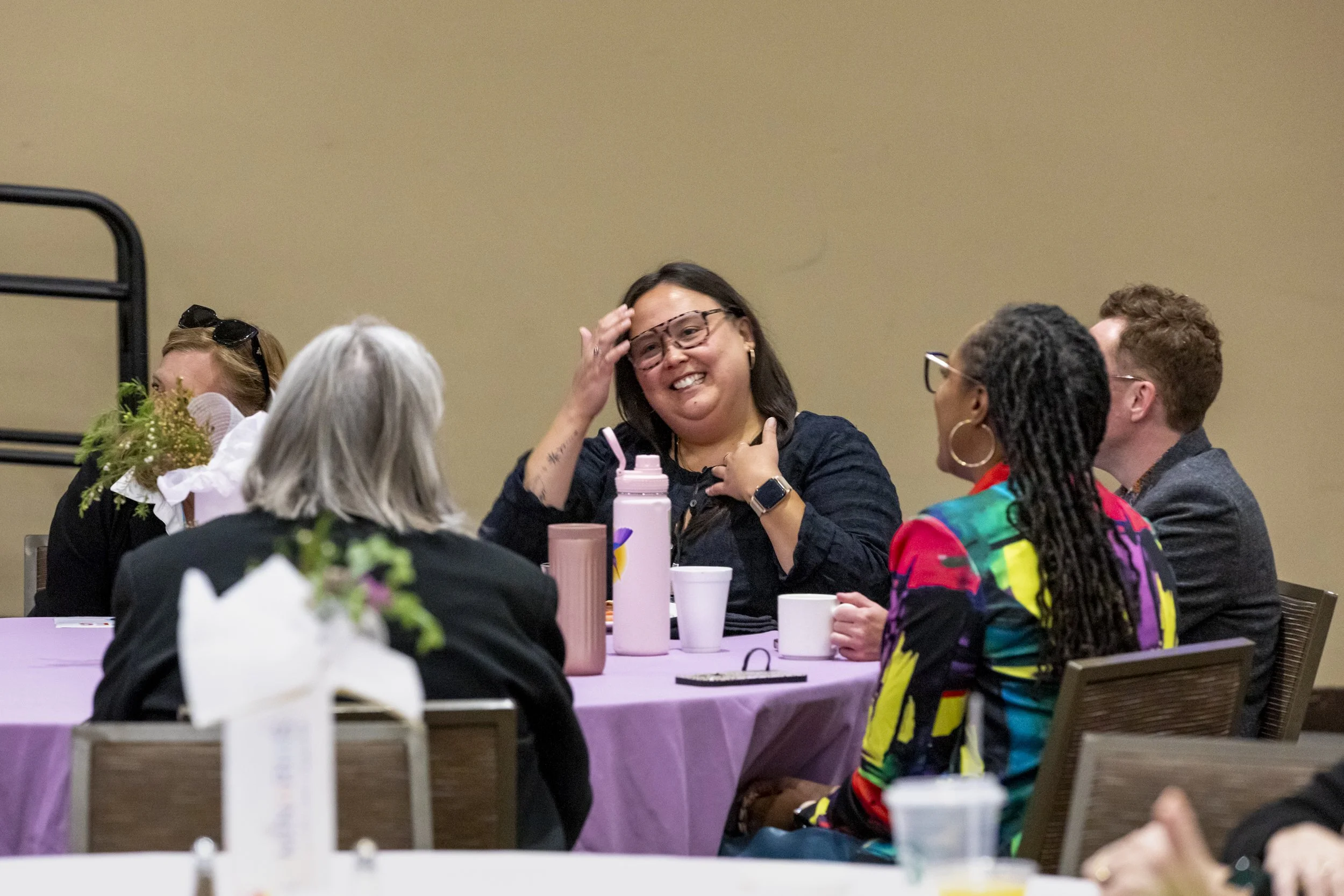 A group of people talking at a table