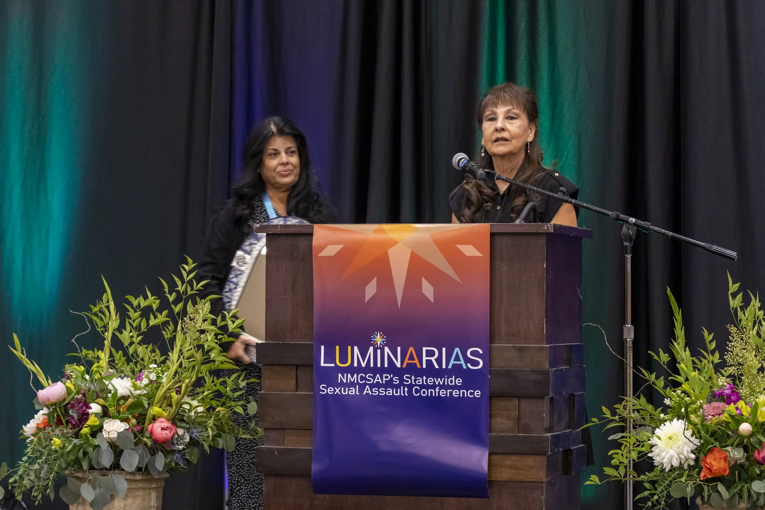 A woman speaking at the podium